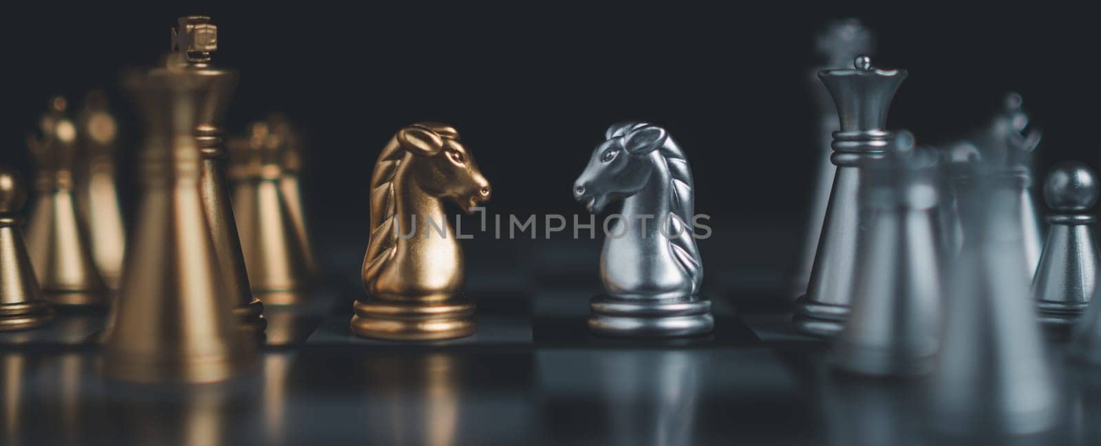 Gold and silver chess pieces in chess board game for business comparison. Leadership concepts, human resource management concepts.