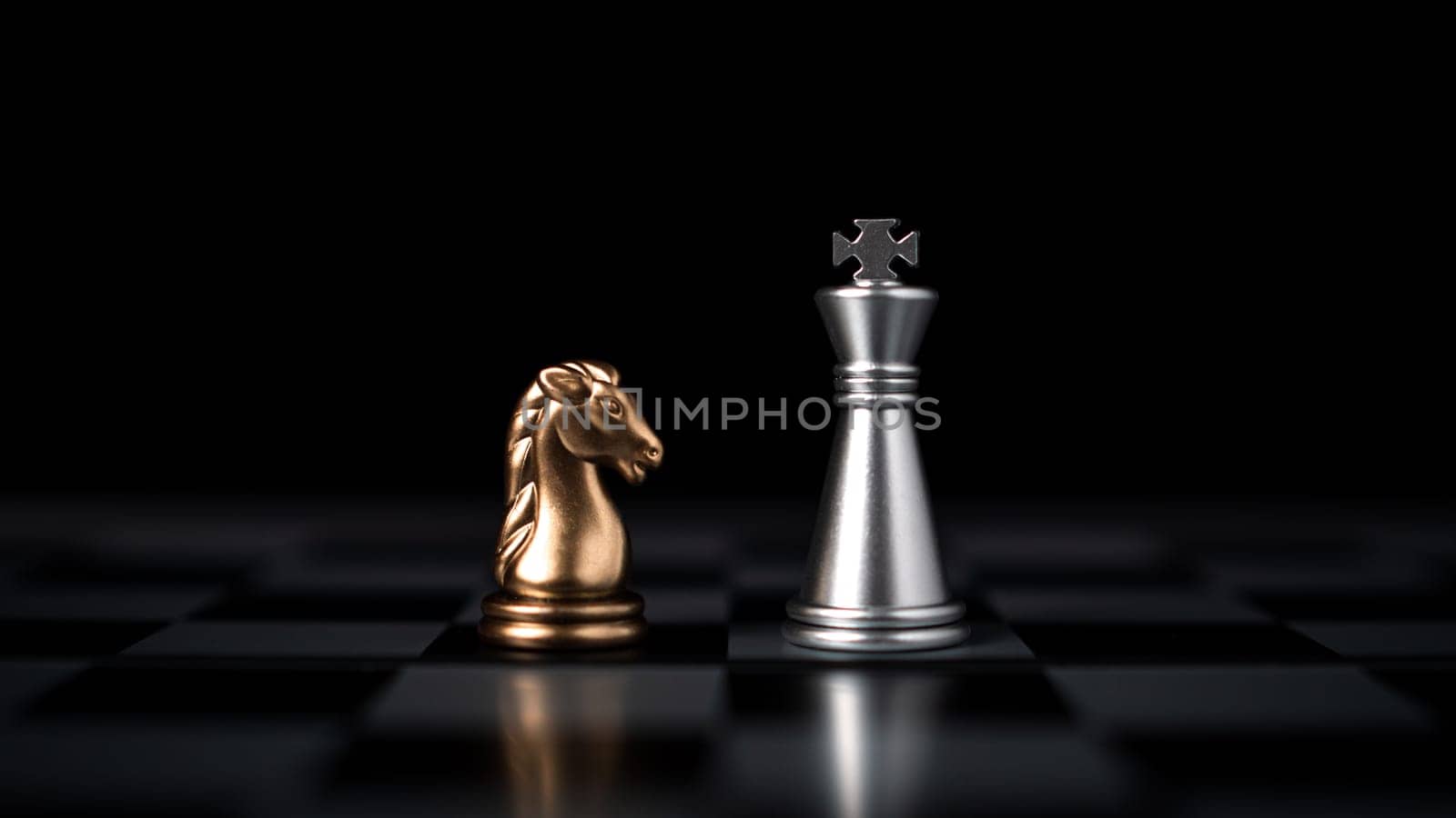 Gold and silver chess pieces in chess board game for business comparison. Leadership concepts, human resource management concepts. by Unimages2527