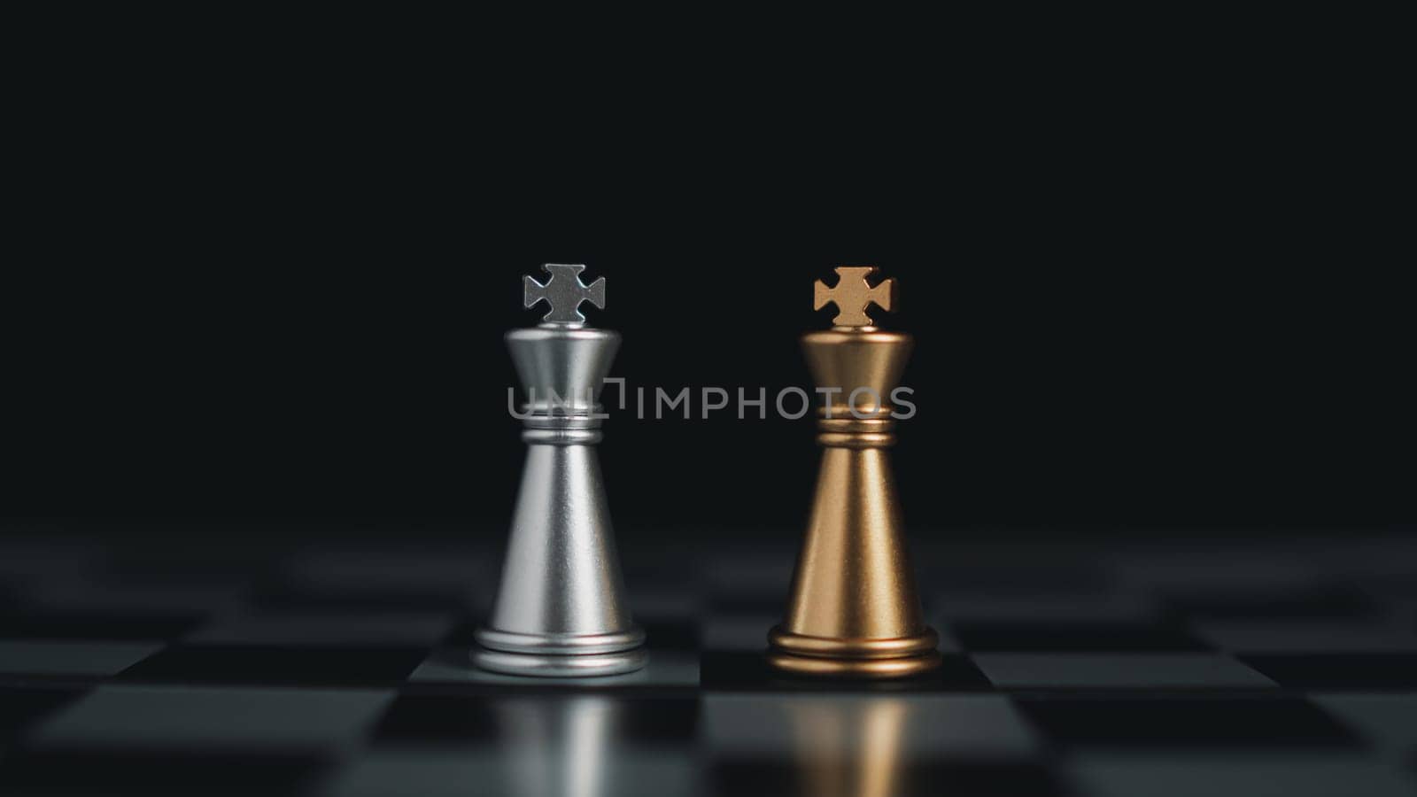 Gold and silver chess pieces in chess board game for business comparison. Leadership concepts, human resource management concepts. by Unimages2527
