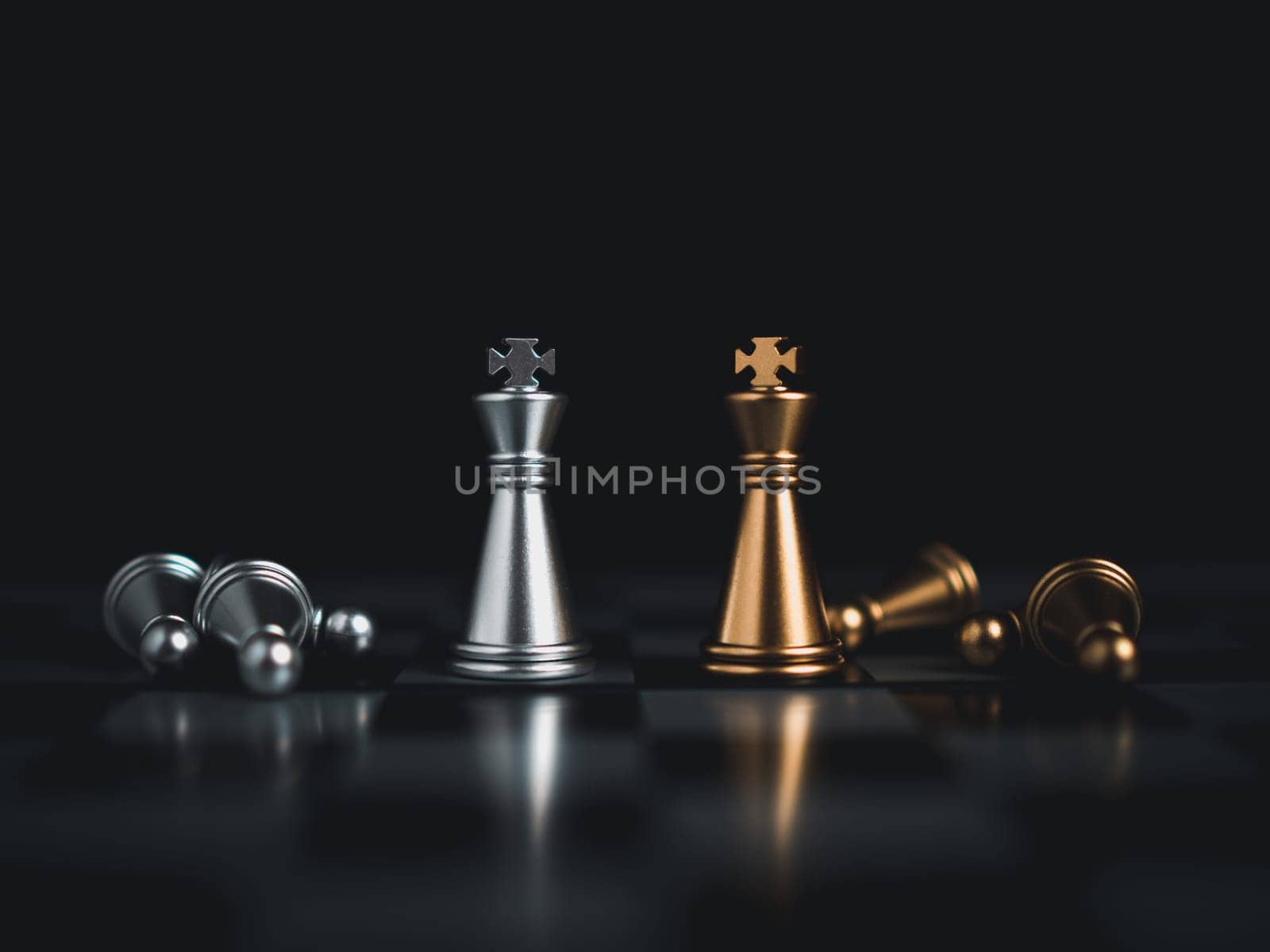 Gold and silver chess pieces in chess board game for business comparison. Leadership concepts, human resource management concepts. by Unimages2527