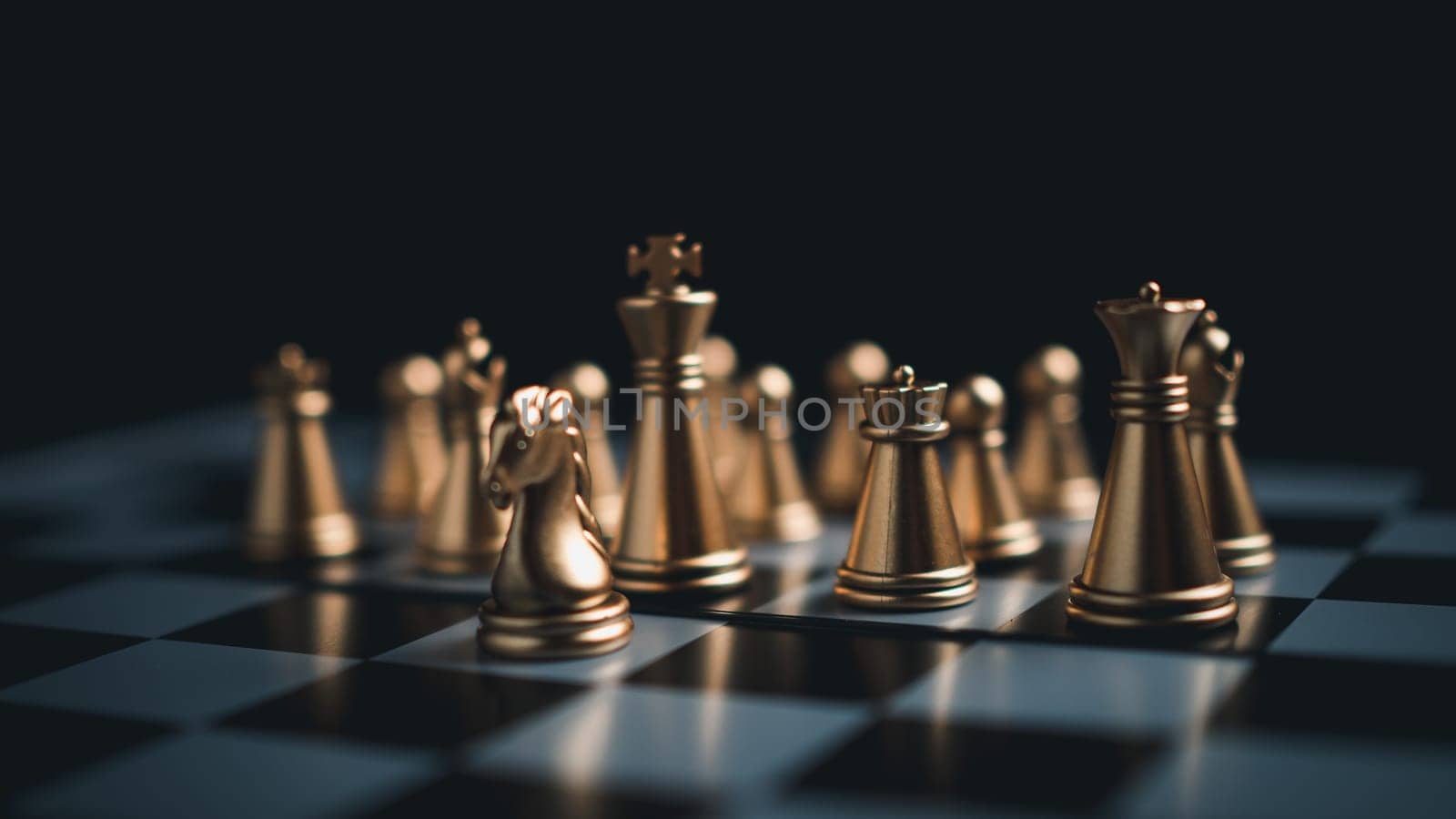 Gold and silver chess pieces in chess board game for business comparison. Leadership concepts, human resource management concepts. by Unimages2527