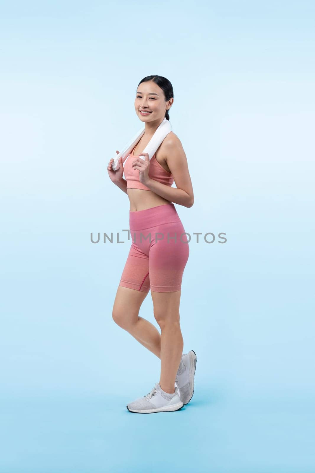 Full body asian woman in sportswear portrait, smiling and posing cheerful gesture. Workout training with attractive girl engage in her pursuit of healthy lifestyle. Isolated background Vigorous