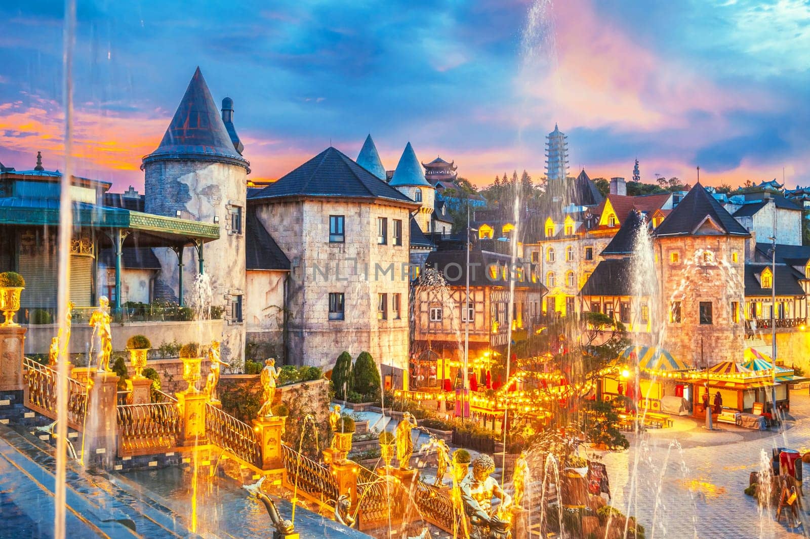 French village in medieval style in Ba Na Hills Park in Da Nang in Vietnam at sunset