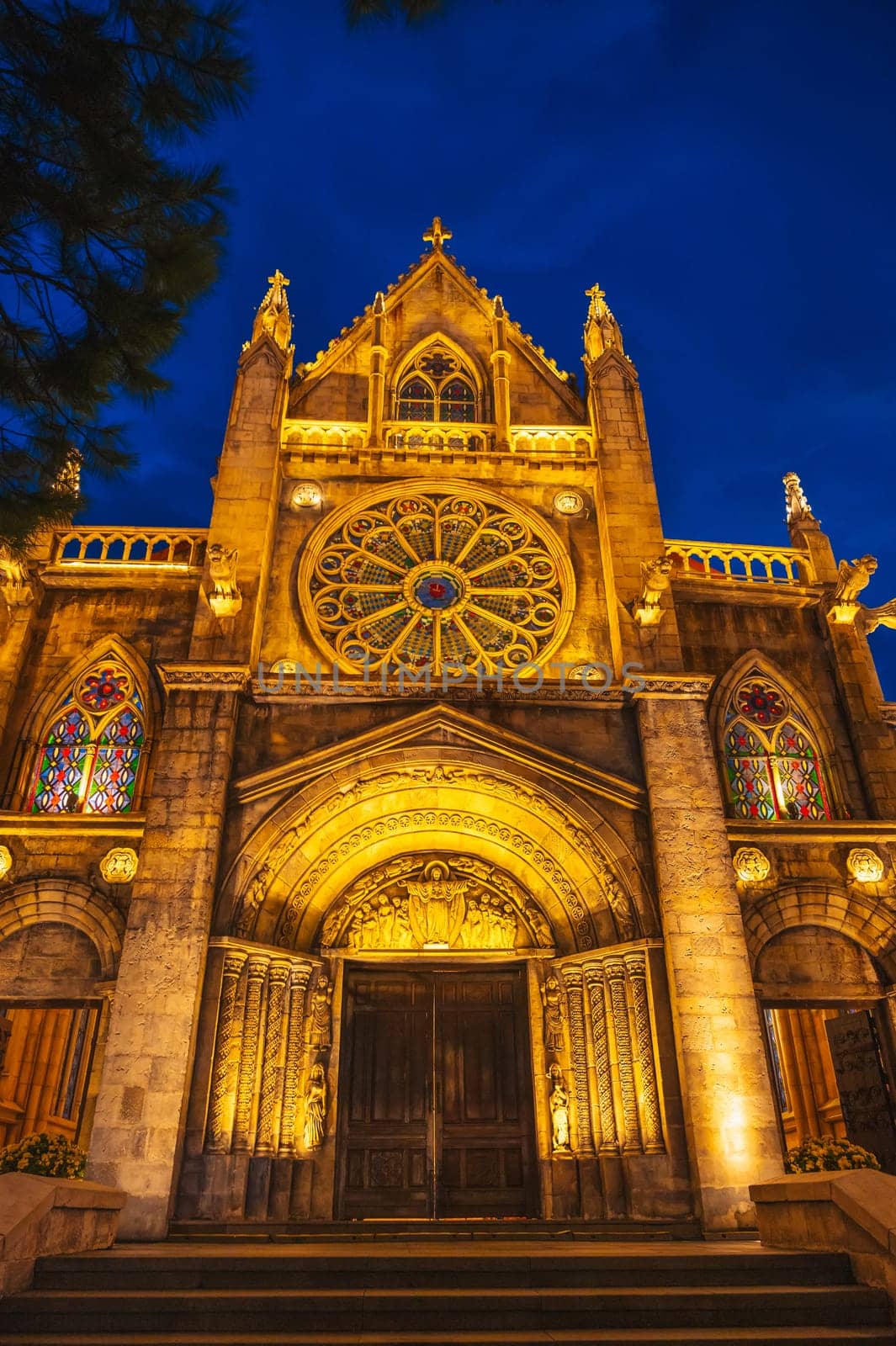 medieval Catholic cathedral in European style in French village in Ba Na Hills Park in Da Nang in Vietnam at night