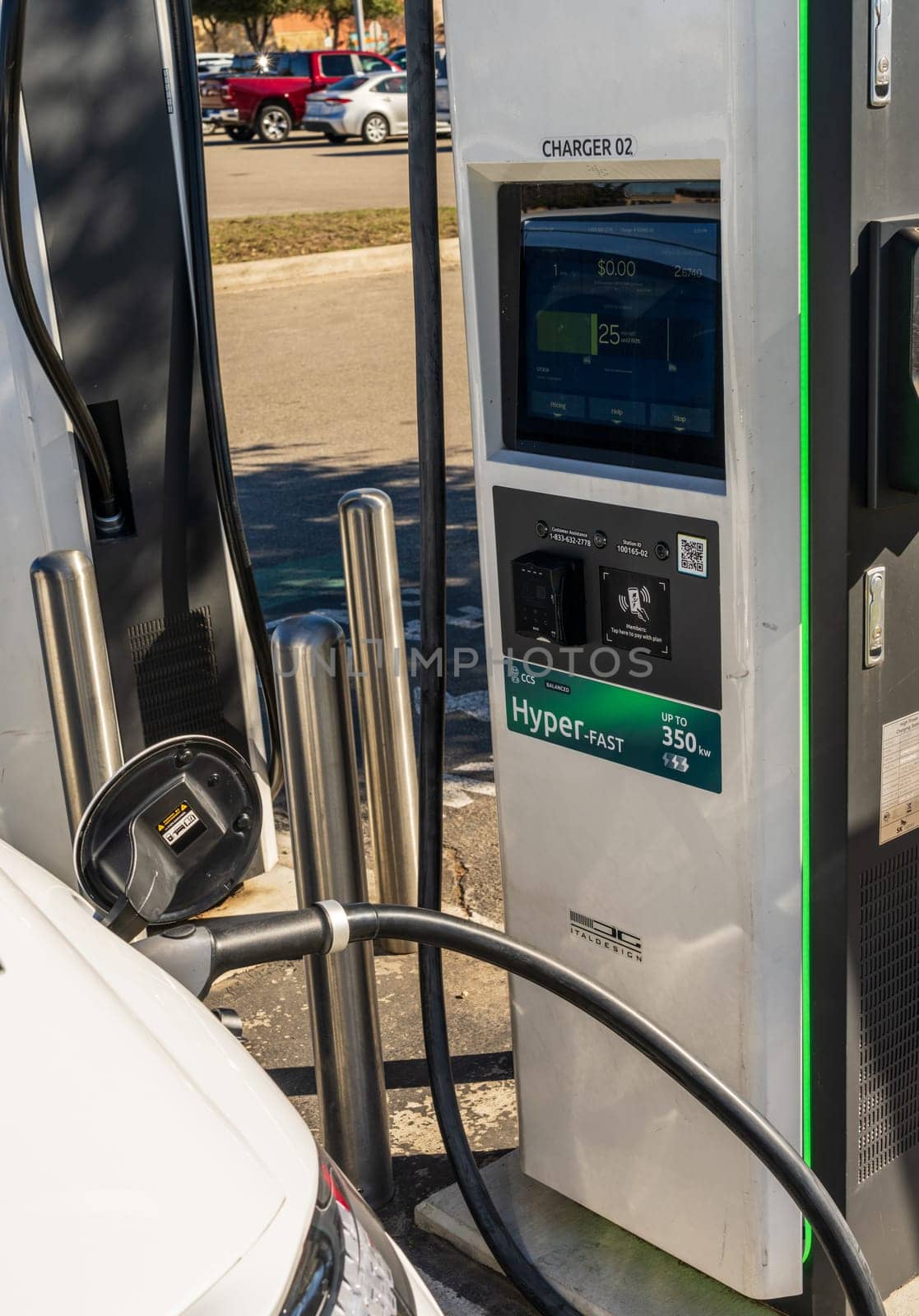 Georgetown, TX - 11 January 2025: Hyundai electric car connected to DC high speed charger at Electrify America public charging unit