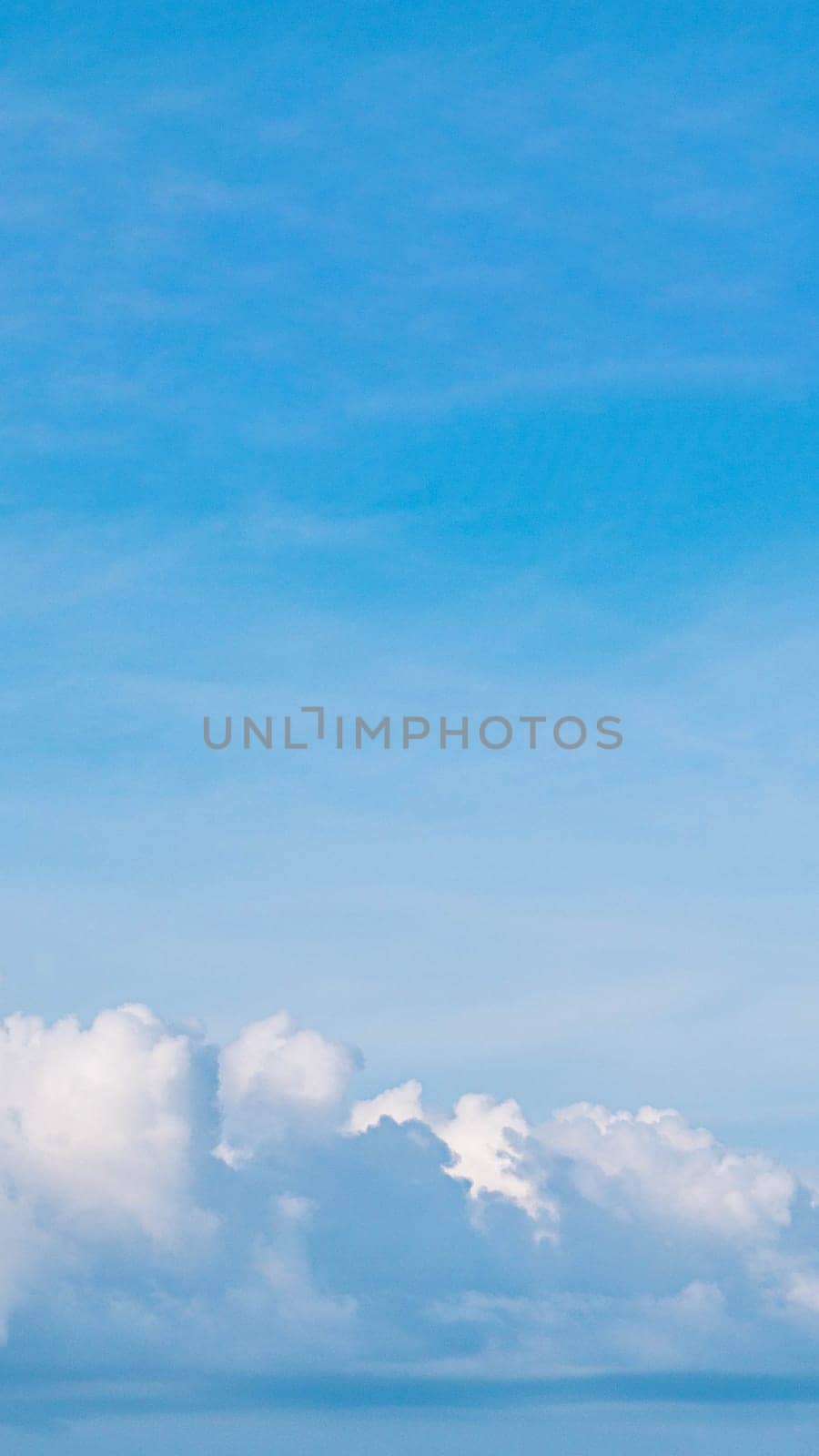 VERTICAL Atmosphere panorama real photo beautiful summer white cloud clear blue sky line calm. Concept paradise life. Design relax wallpaper background. More tone format in stock, fantasy collection.