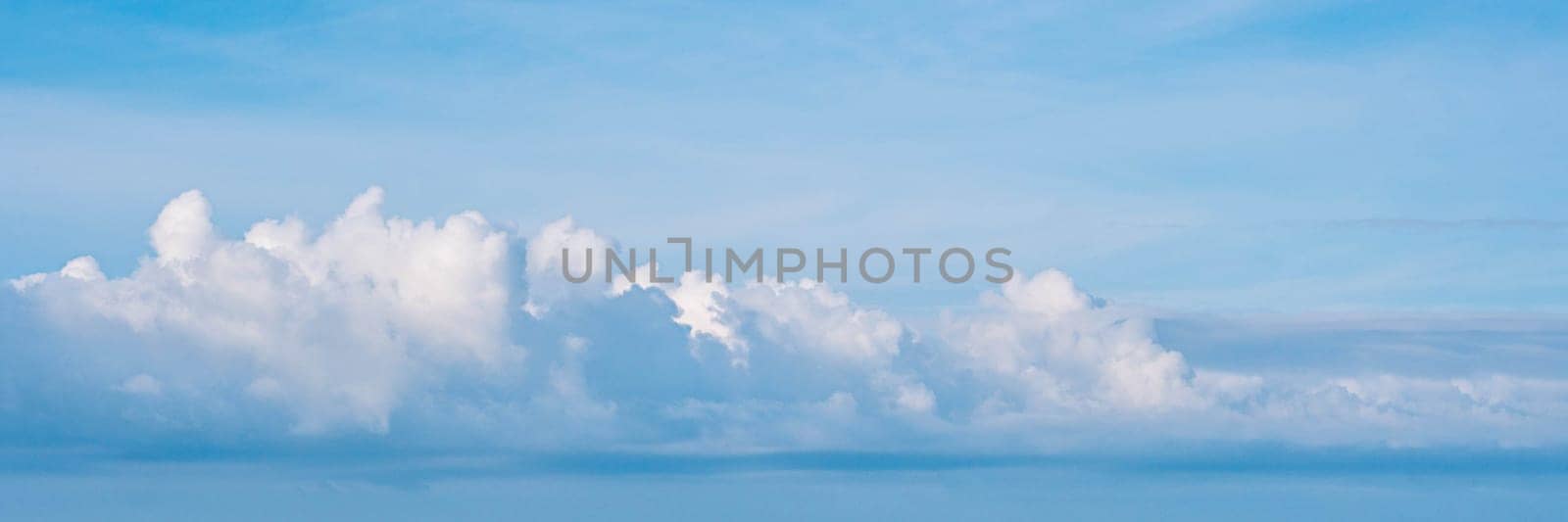 BANNER Atmosphere long panorama real photo beautiful summer white cloud clear blue sky line calm. Concept paradise life. Design relax wallpaper background More tone format fantasy collection in stock