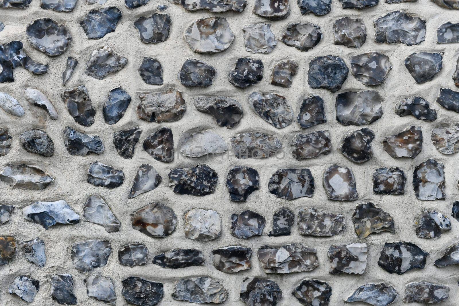 Flint stone wall. Building in Normandy France Alabaster Coast