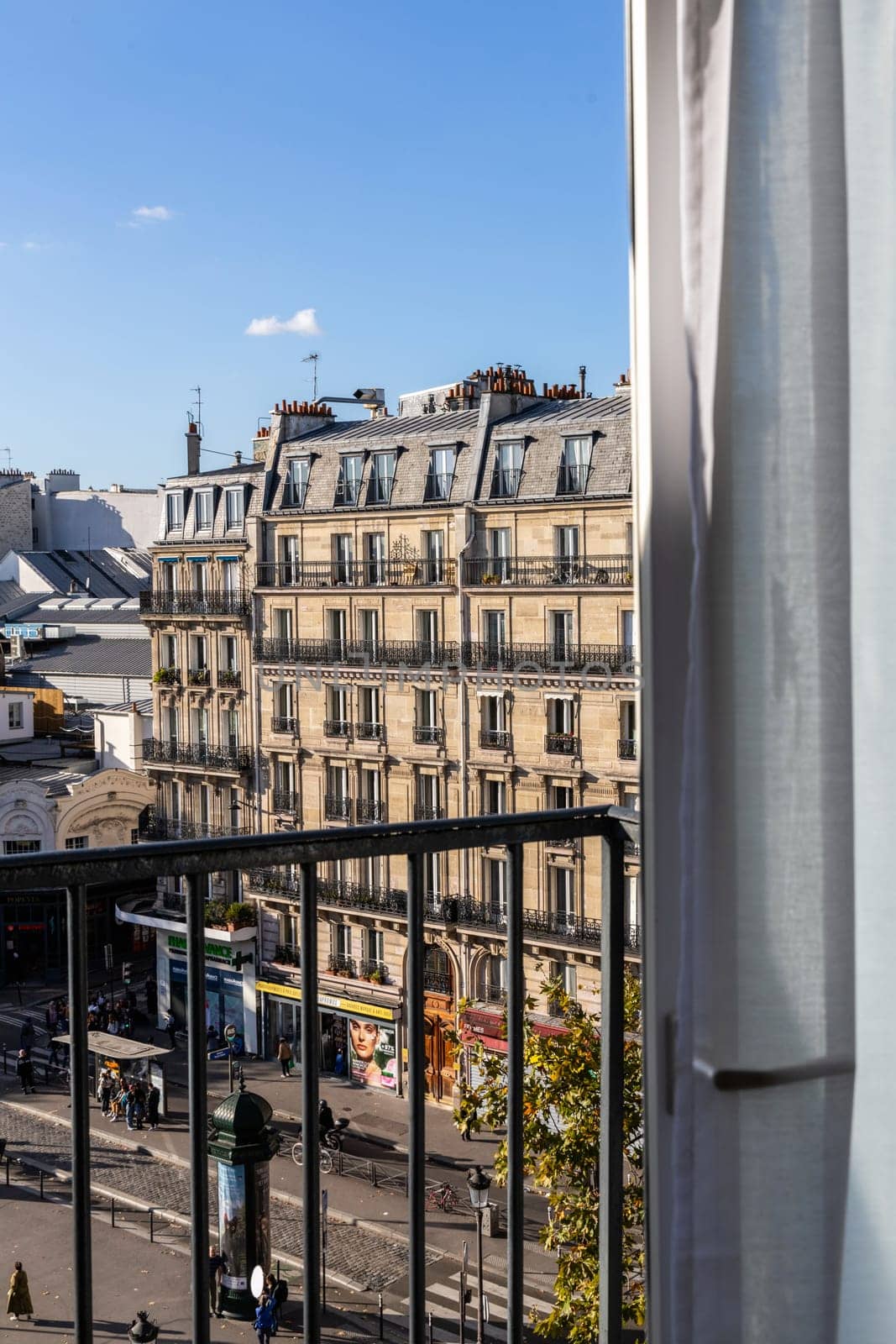 Open window overlooking the city with old buildings. Paris, France - October 24, 2024