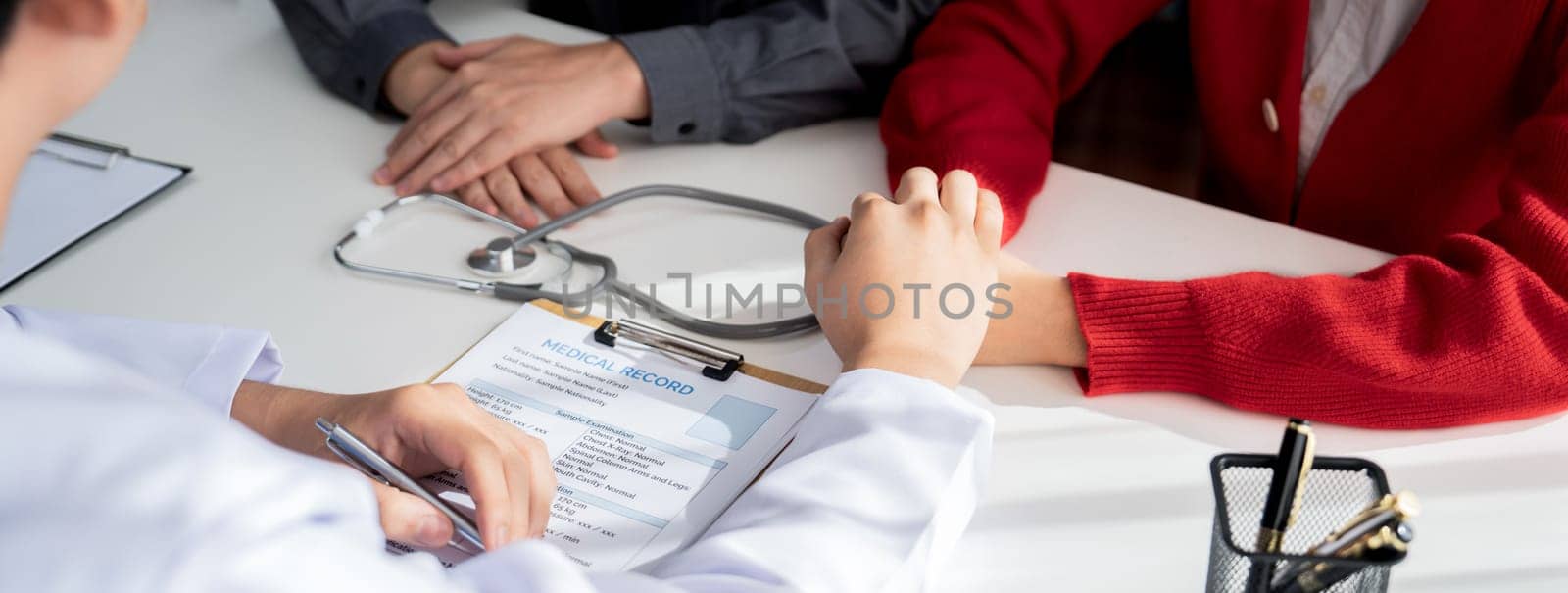 Couple attend fertility consultation with gynecologist at hospital. Rigid by biancoblue