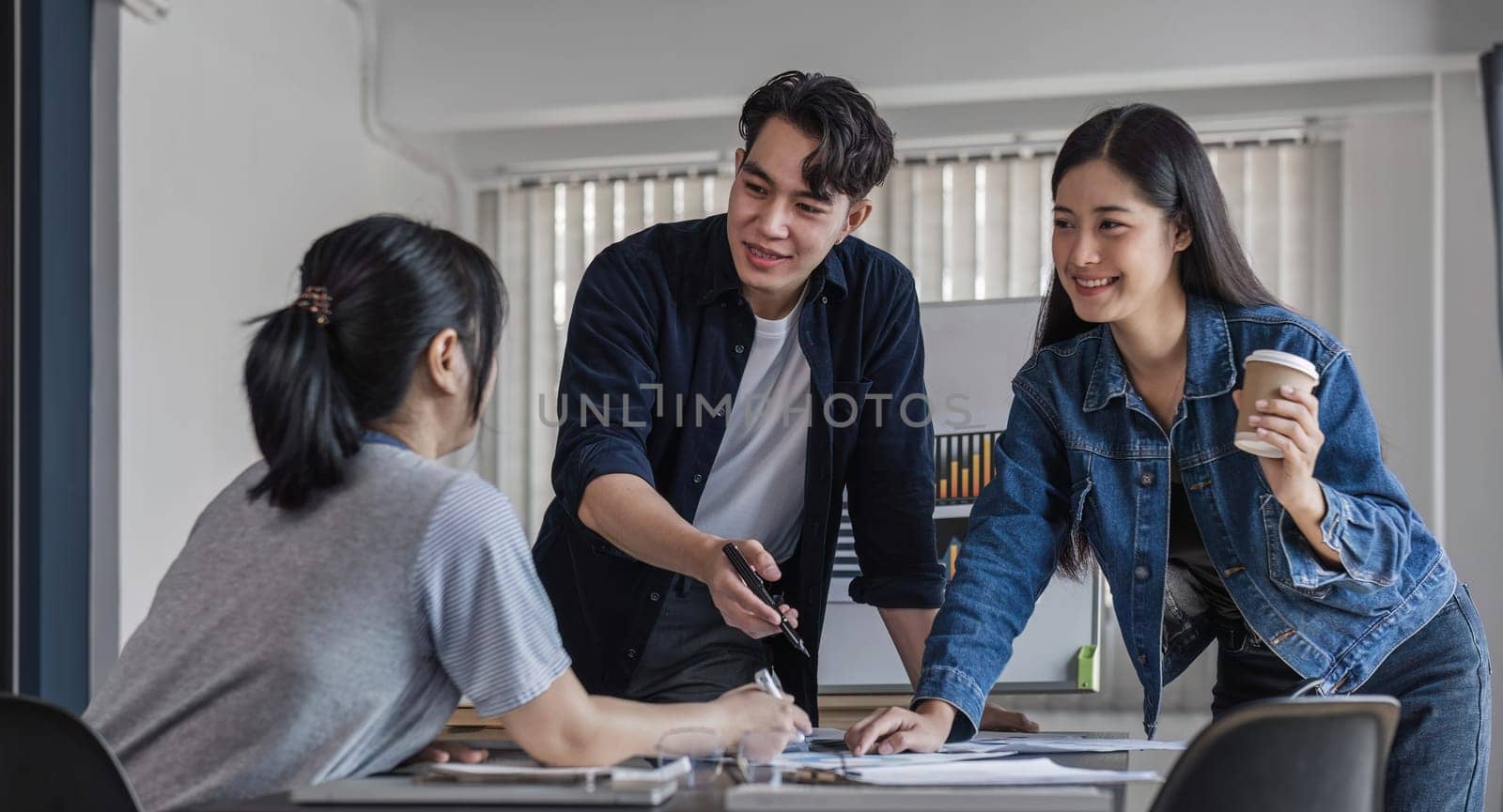 Business People Meeting using laptop computer,calculator,notebook,stock market chart paper for analysis Plans to improve quality next month. Conference Discussion Corporate Concept.