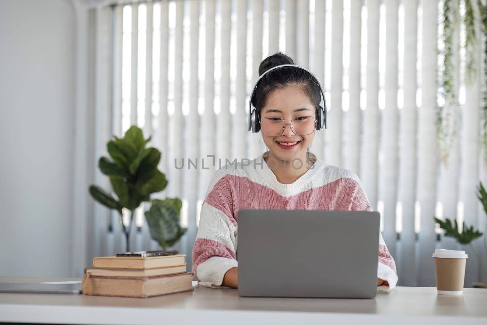 Asian girl student online learning class study online video call teacher, Happy asian girl learn language online with computer laptop by wichayada