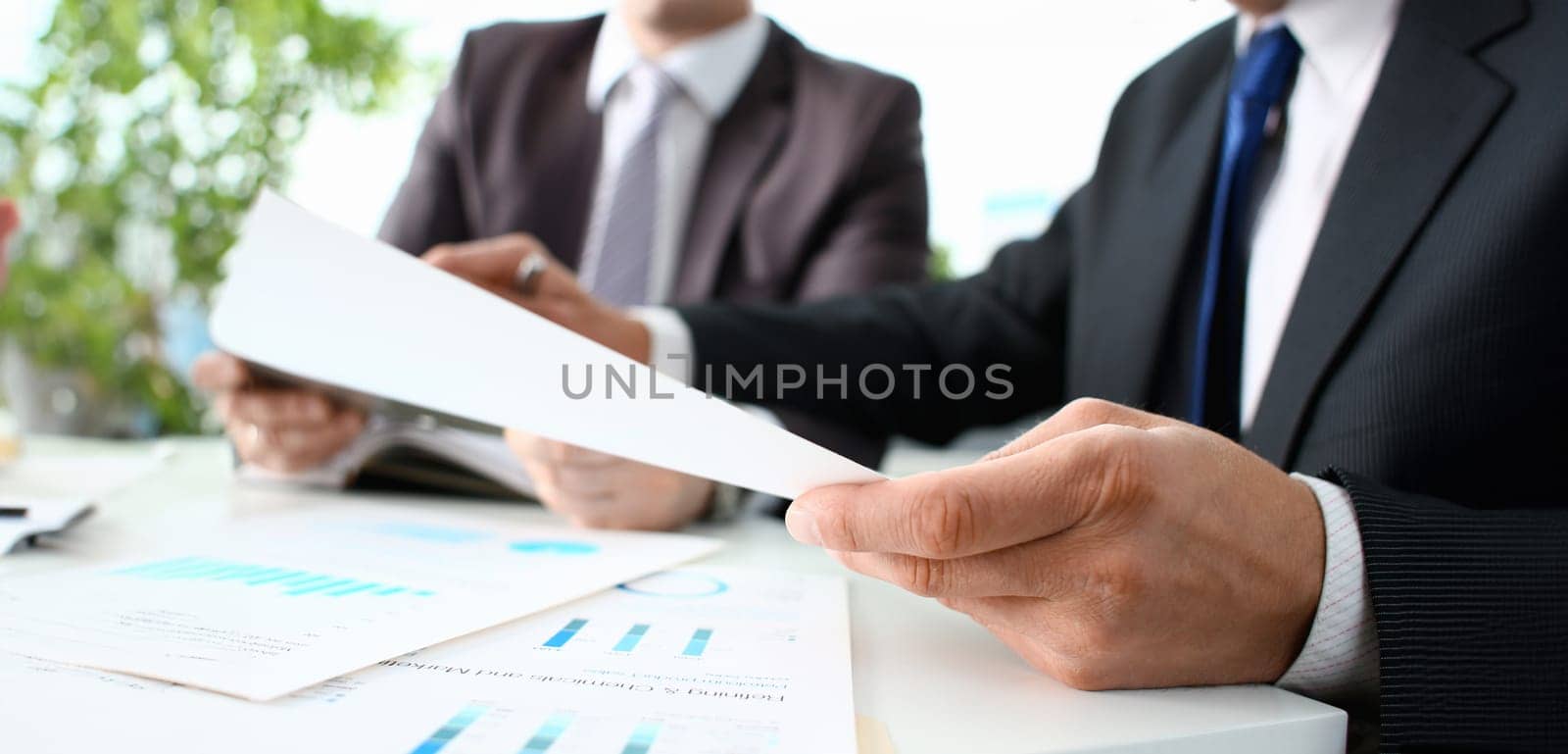 Financial statistics documents ball pen infographics at office table closeup. Internal Revenue Service inspector sum check investigation exchange market earnings savings loan and credit concept