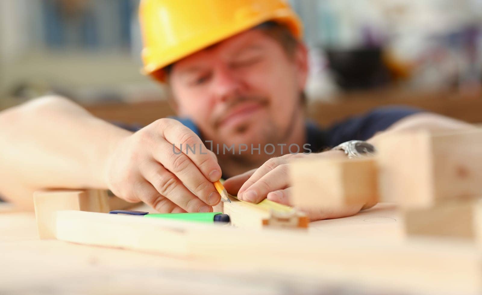 Arms of worker measuring wooden bar portrait. Manual job DIY inspiration improvement job fix shop yellow helmet joinery startup workplace idea hard hat career ruler industrial education