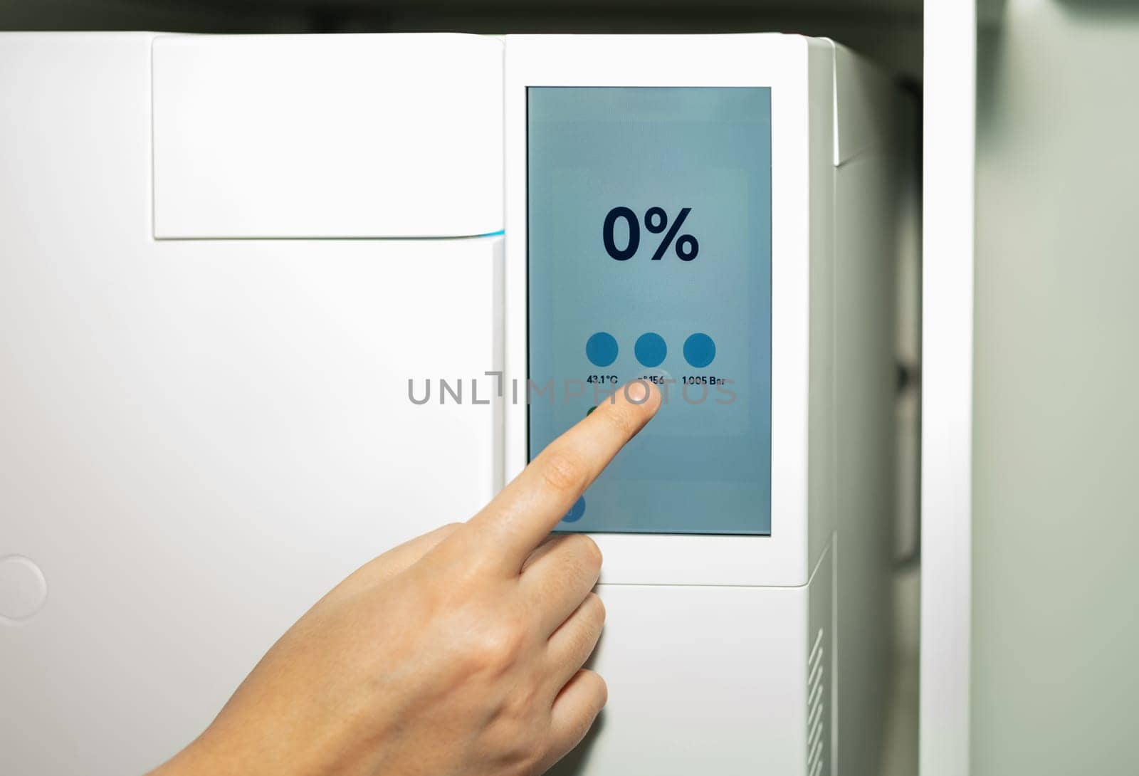 Autoclave sterilizer for stainless steel dental tools for sterilizing. Thermostat in a modern dentistry clinic.