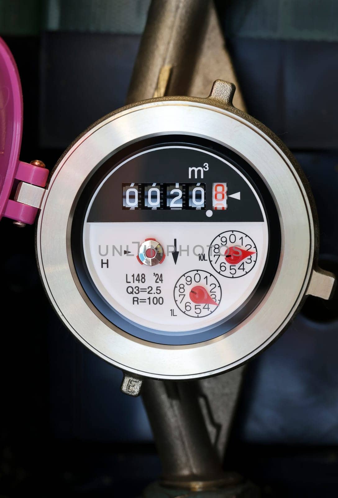 Close up of gauge for water consumption, A water meter in the grounds of a Japanese house.