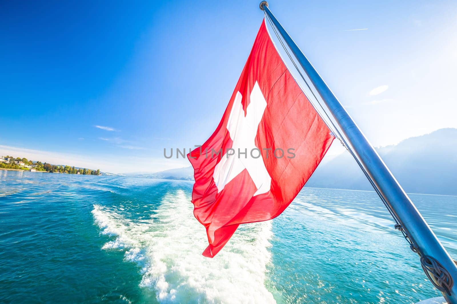 Switzerland flag on boat flowing Luzern lake by xbrchx