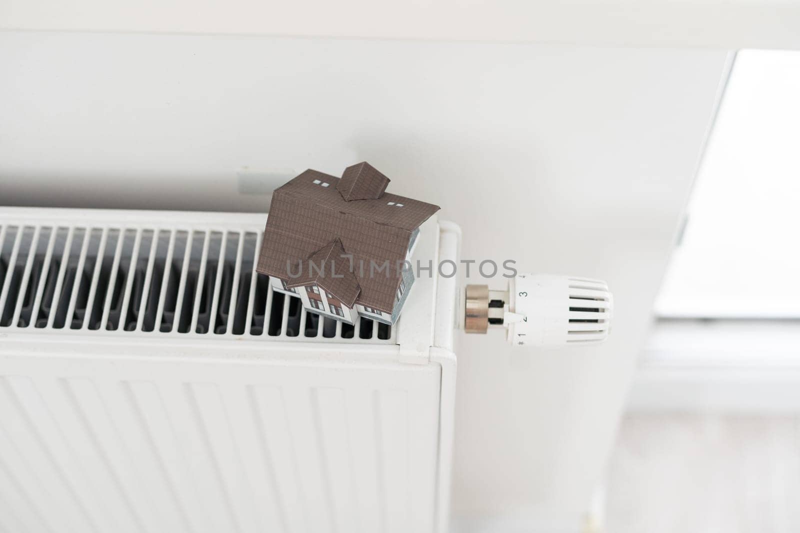 House model on the heating radiator. High quality photo