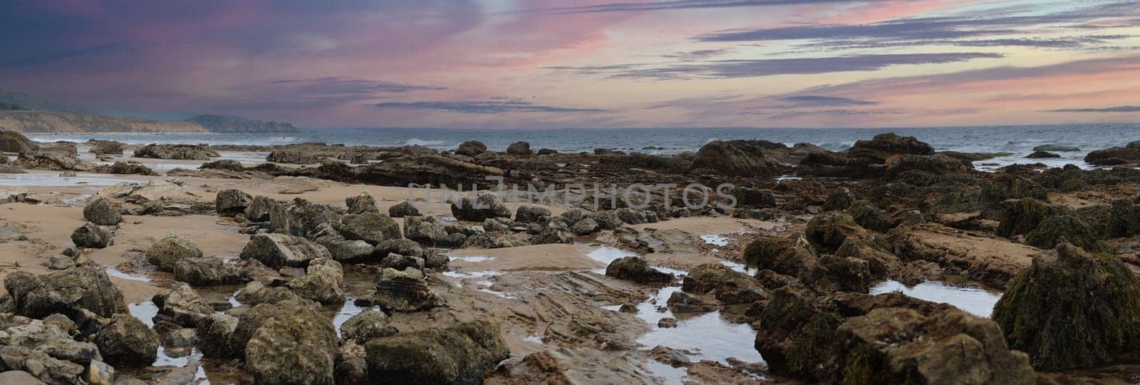 Panoramic tide pools, at Newport beach coastal Crystal Cove, sand, beach, waves and rocks. At sunset. High quality photo