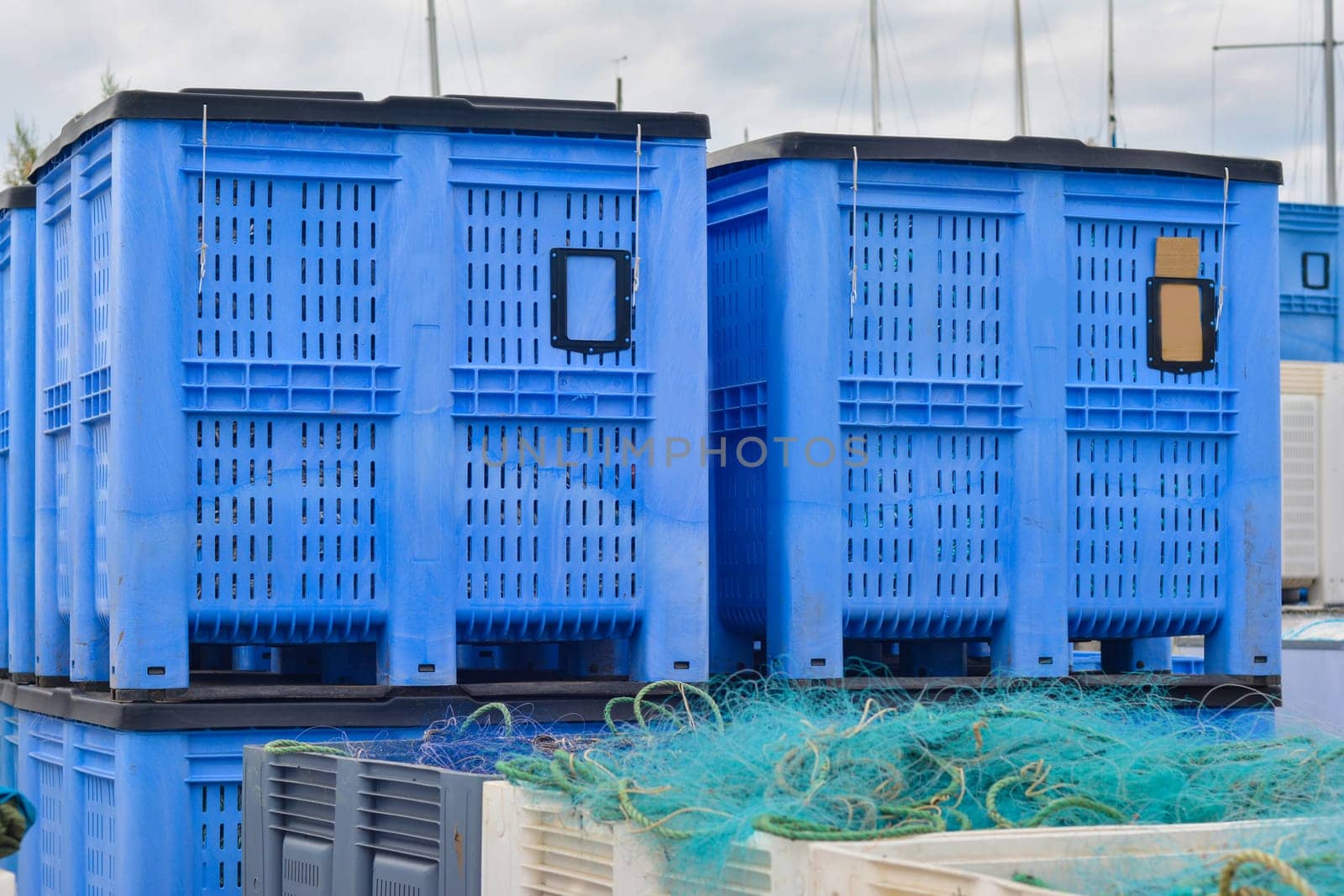 Plastic containers of fishing nets in the port.