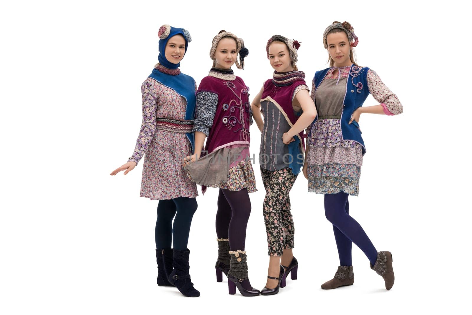 Teenaged girls wearing fashion pink and violet costumes and hats isolated view