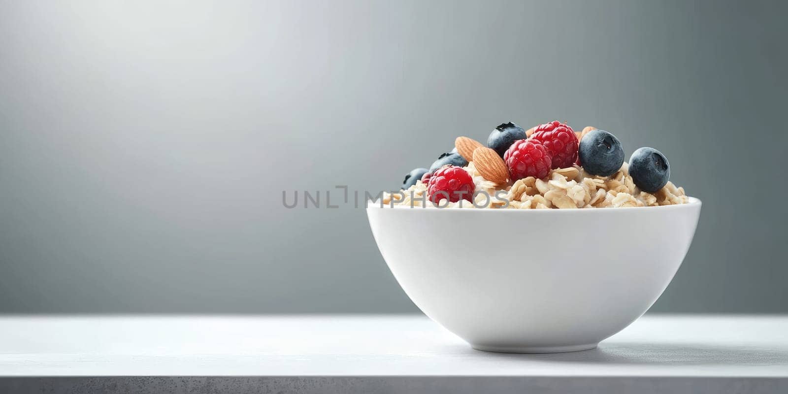 Healthy breakfast bowl with steaming oatmeal, fresh berries, and crunchy nuts on a minimalist table setting.