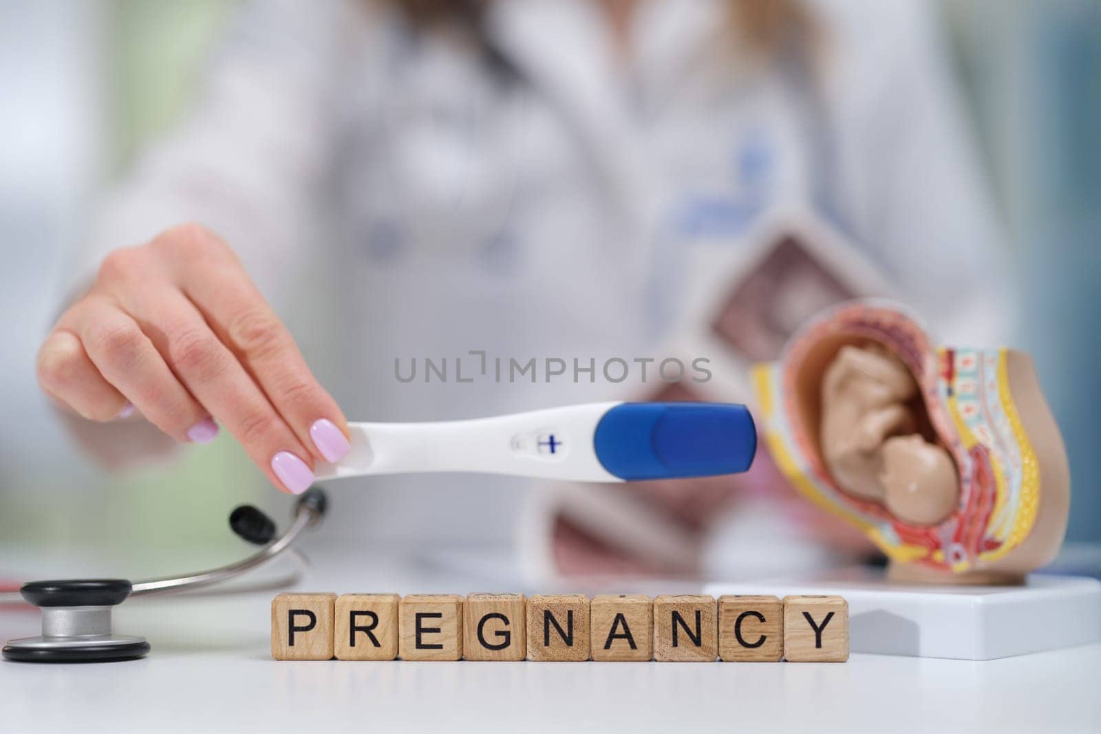 A pregnancy test that comes along with various medical tools illustrating important pregnancyrelated information