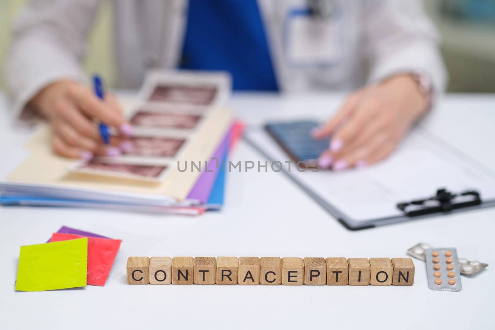 A healthcare professional discusses contraception options, using educational materials to improve understanding