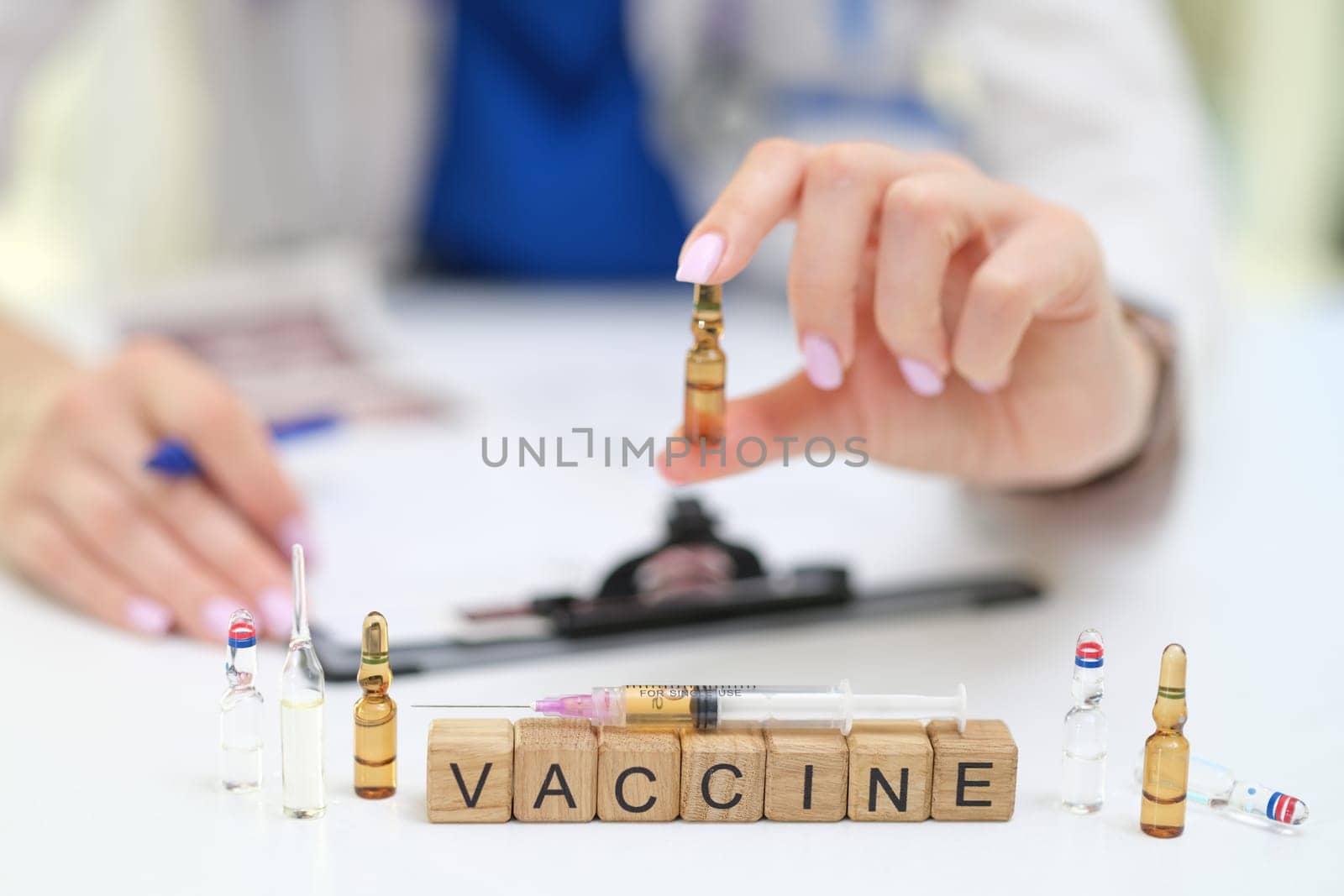 A health professional carefully handles vaccine vials, highlighting the vital importance of vaccination and health care