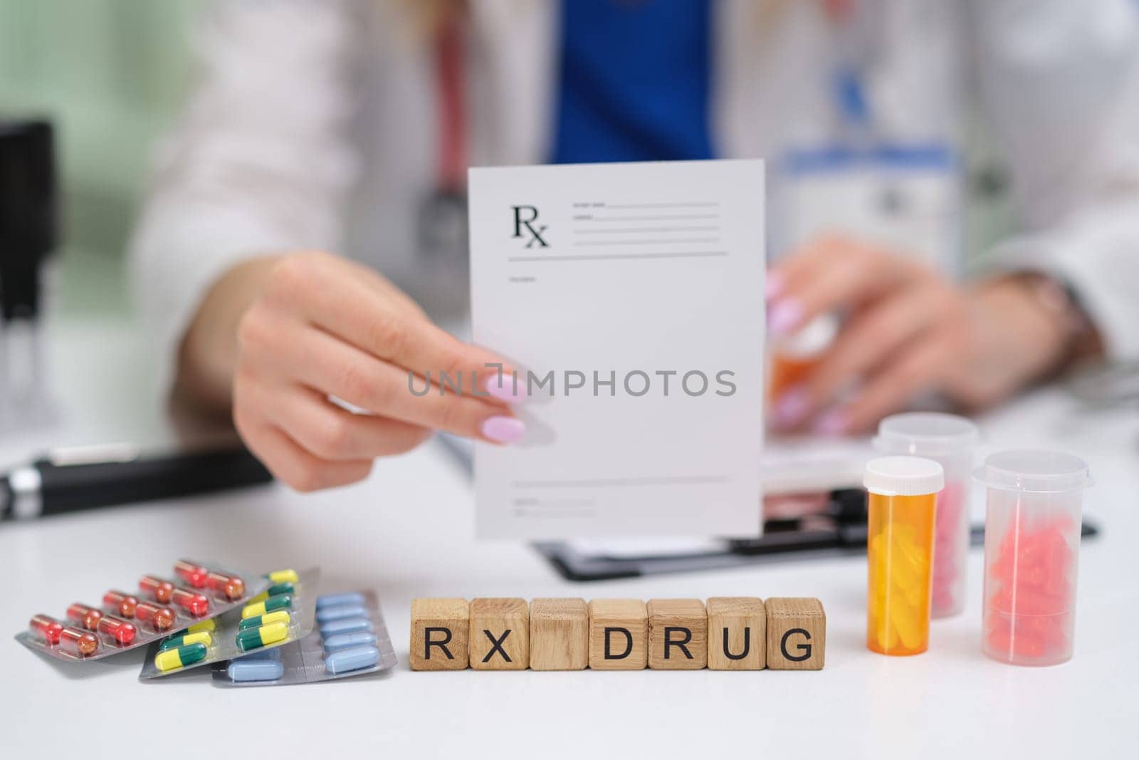 Closeup of a prescription pad showing various medications and RX drug blocks in a clinical setting