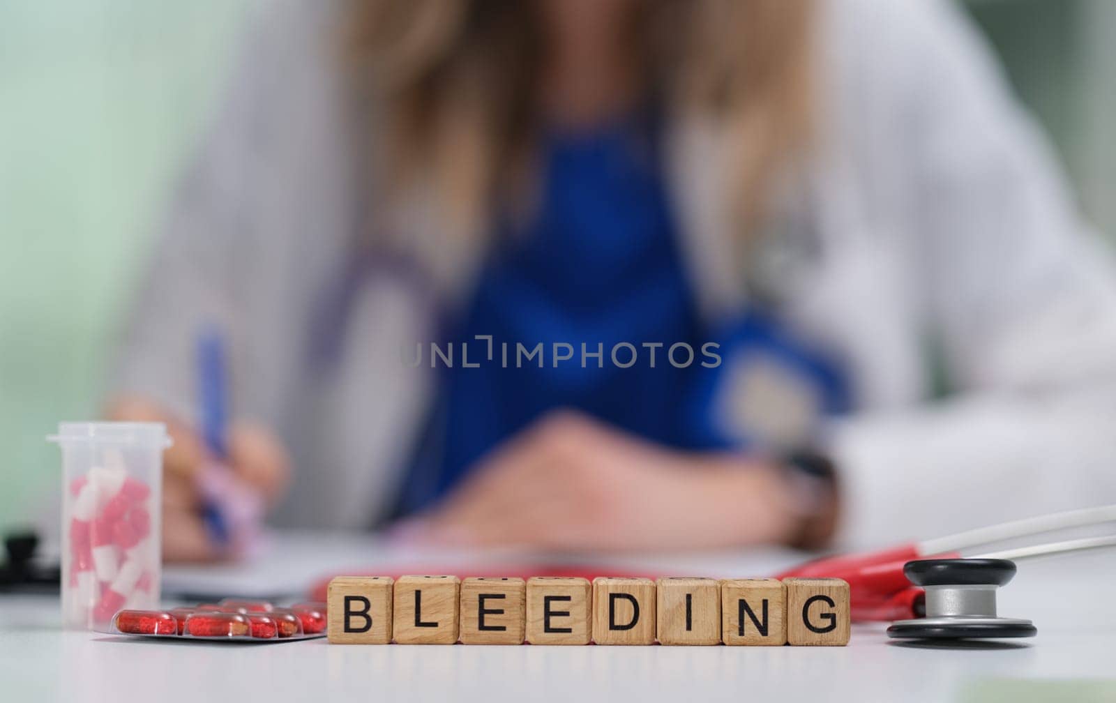 A healthcare professional assesses a bleeding condition with specialized tools, making detailed notes