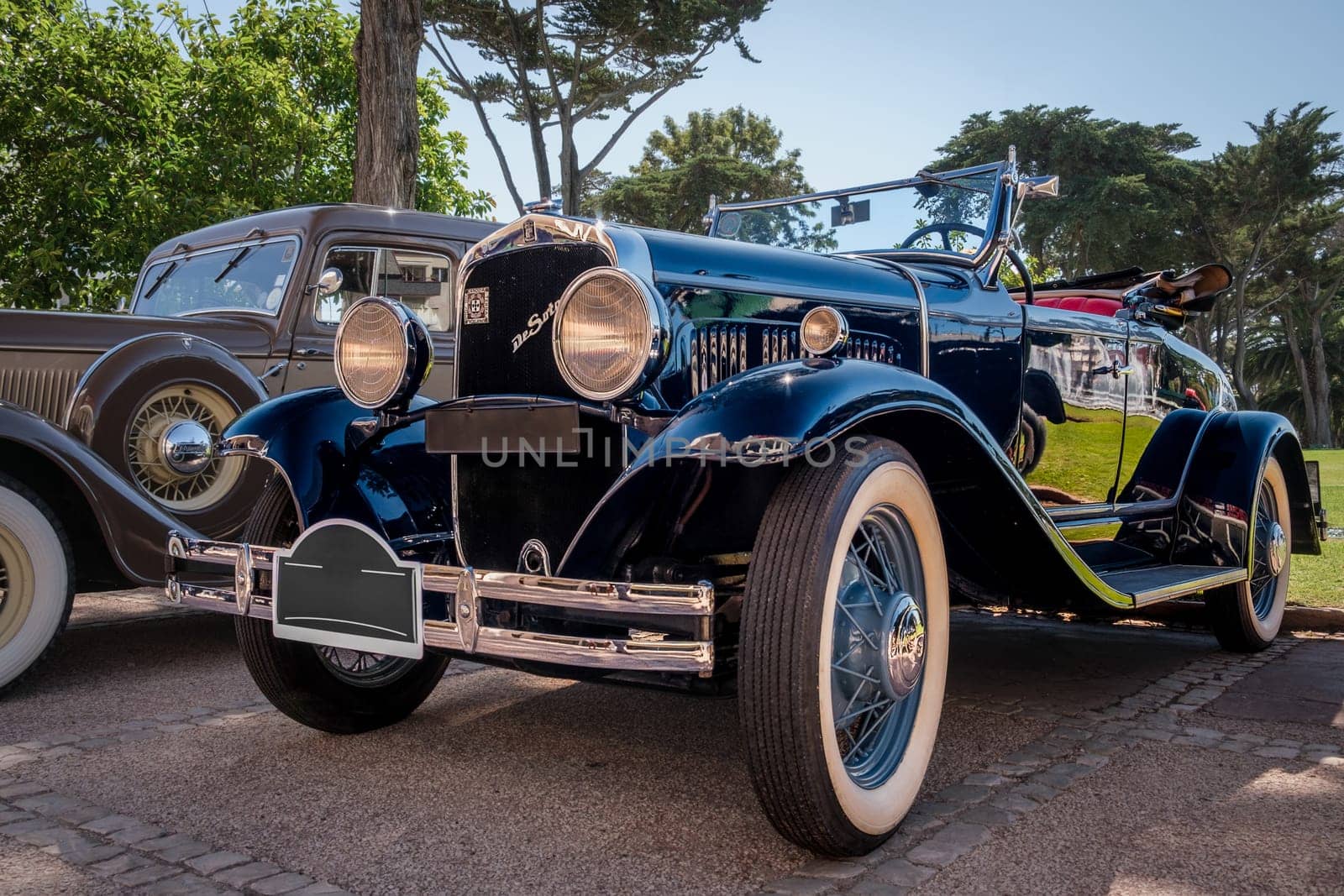 Lisbon, Portugal - Sep 29, 2024: Original De Soto Straight 8 Tourer built in 1930 on sunny day near park, De Soto cheapest model, Chrysler Corp, USA. Family size car, soft top down.