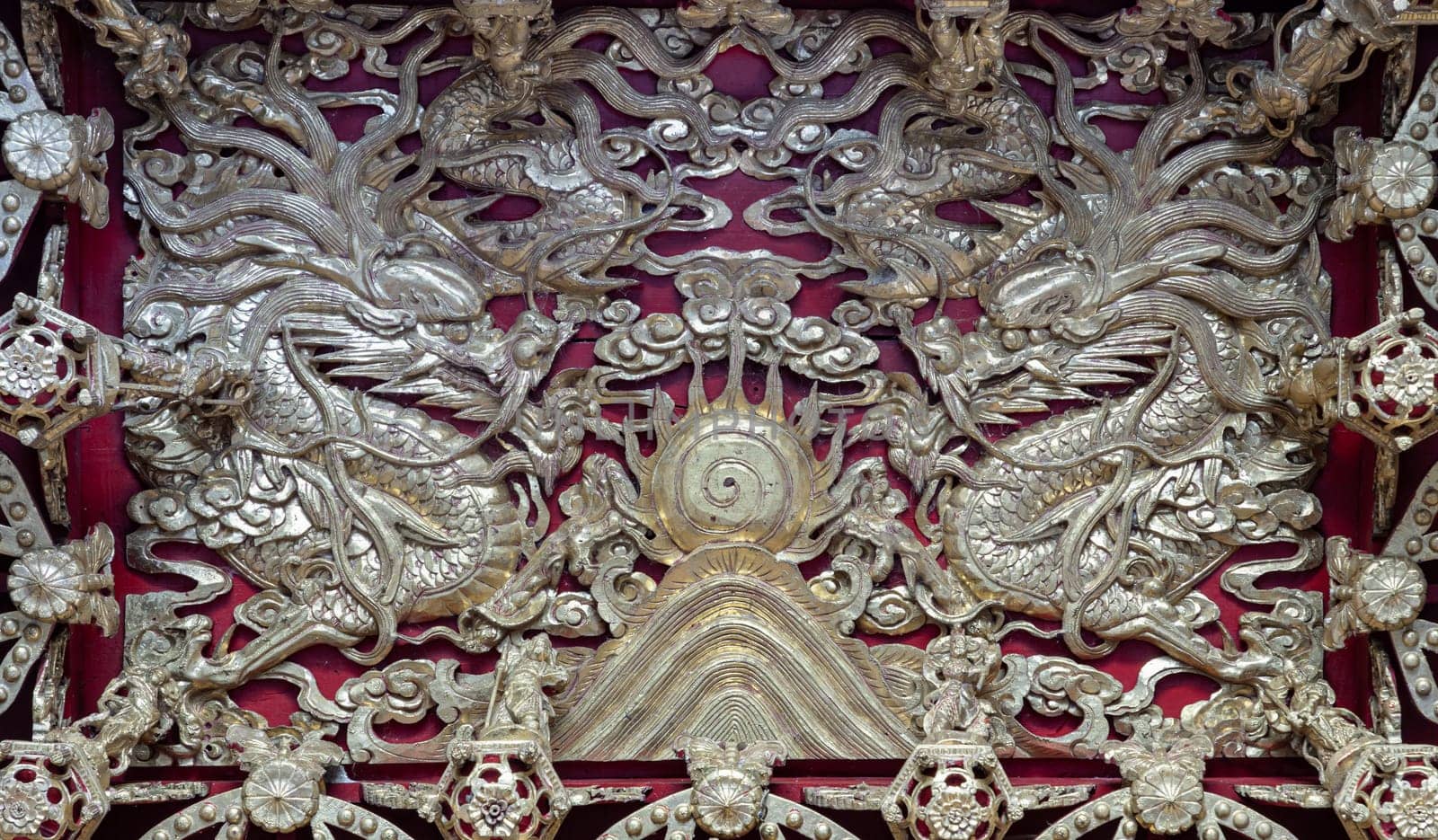 Samut Prakan, Thailand - Jan 11, 2025 - Elaborate sculptures on ceiling design inside the Buddhist temple of Wat Dhammakatanyu (Xian Lo Dai Tien Gong). Taiwanese art style, Look up, use it as your Wallpaper, Poster and Space for text, Selective focus.