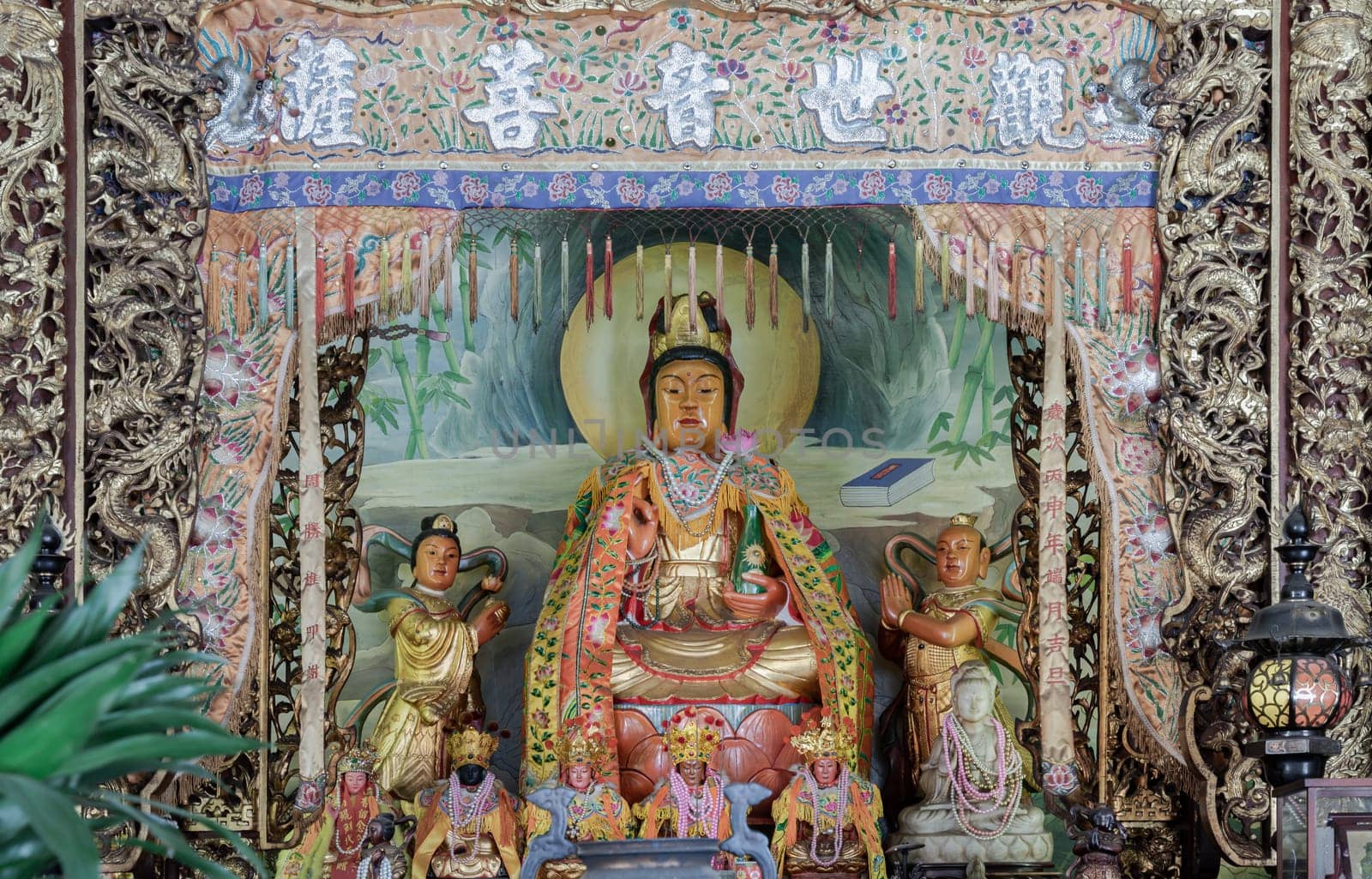 Samut Prakan, Thailand - Jan 11, 2025 - Quan Yin Statue(Guan Yin Buddha) in Kuan Yin shrine inside the Buddhist temple of Wat Dhammakatanyu (Xian Lo Dai Tien Gong). Taiwanese art style, use it as your Wallpaper, Poster and Space for text, Selective focus.