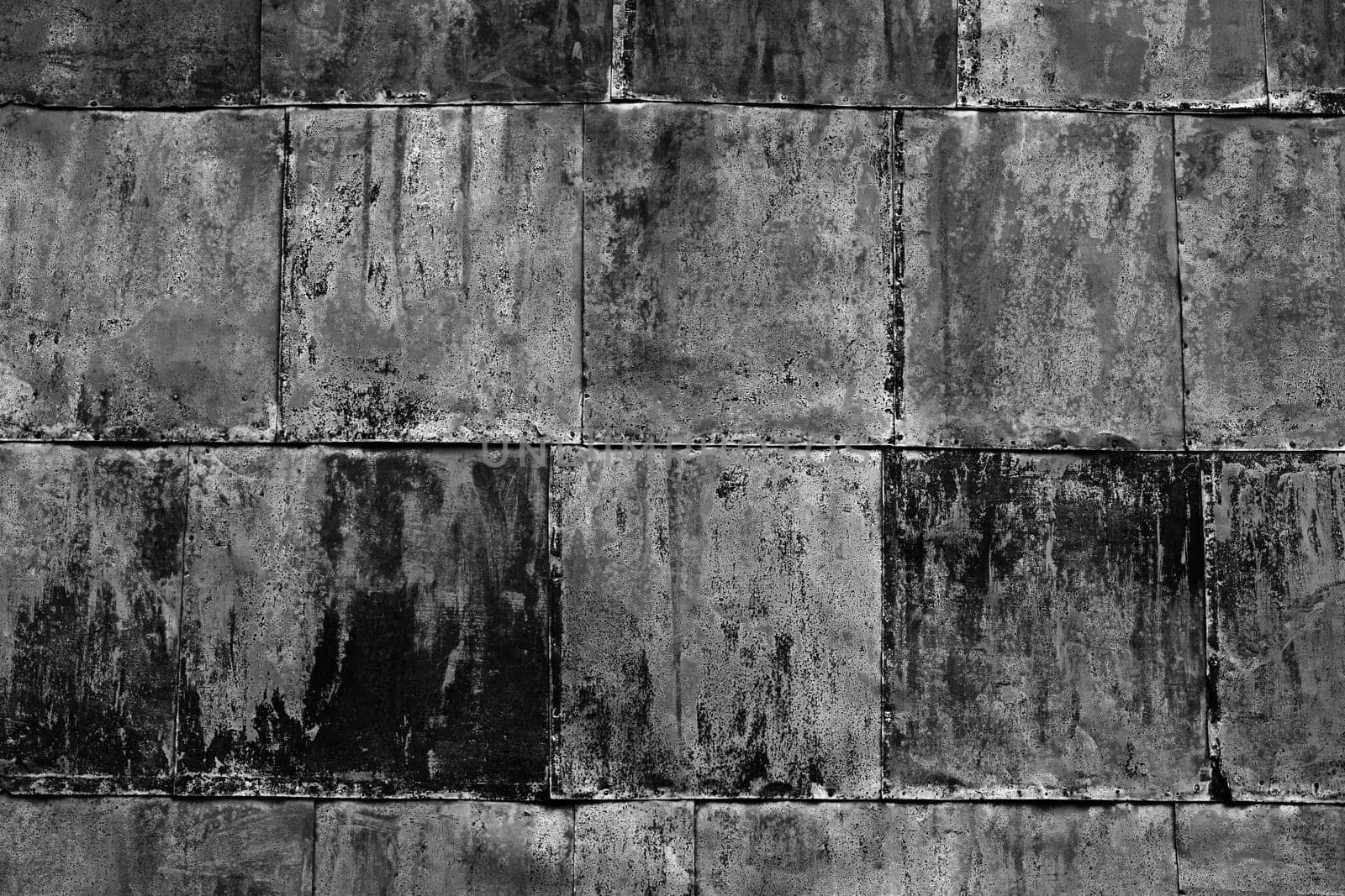 Background of an old sheet metal wall in black and white