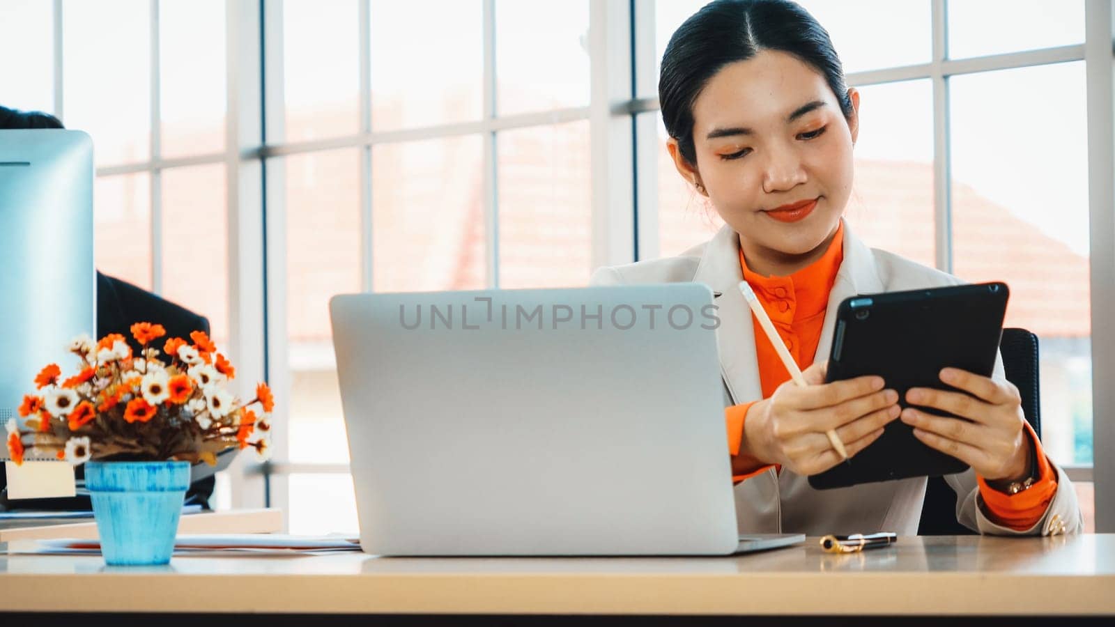 Business people working at table in modern office Jivy by biancoblue