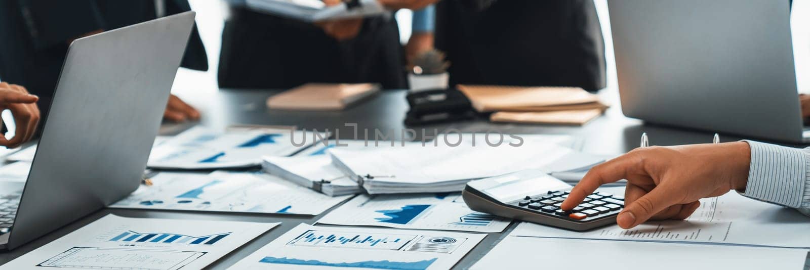 Auditor team collaborate in office, analyzing financial data and accounting record. Expertise in finance and taxation with accurate report and planning for company revenue, expense and budget. Insight