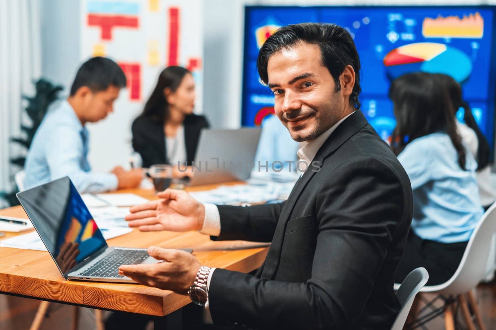 Portrait of businessman or analyst looking at camera in meeting. Meticulous by biancoblue