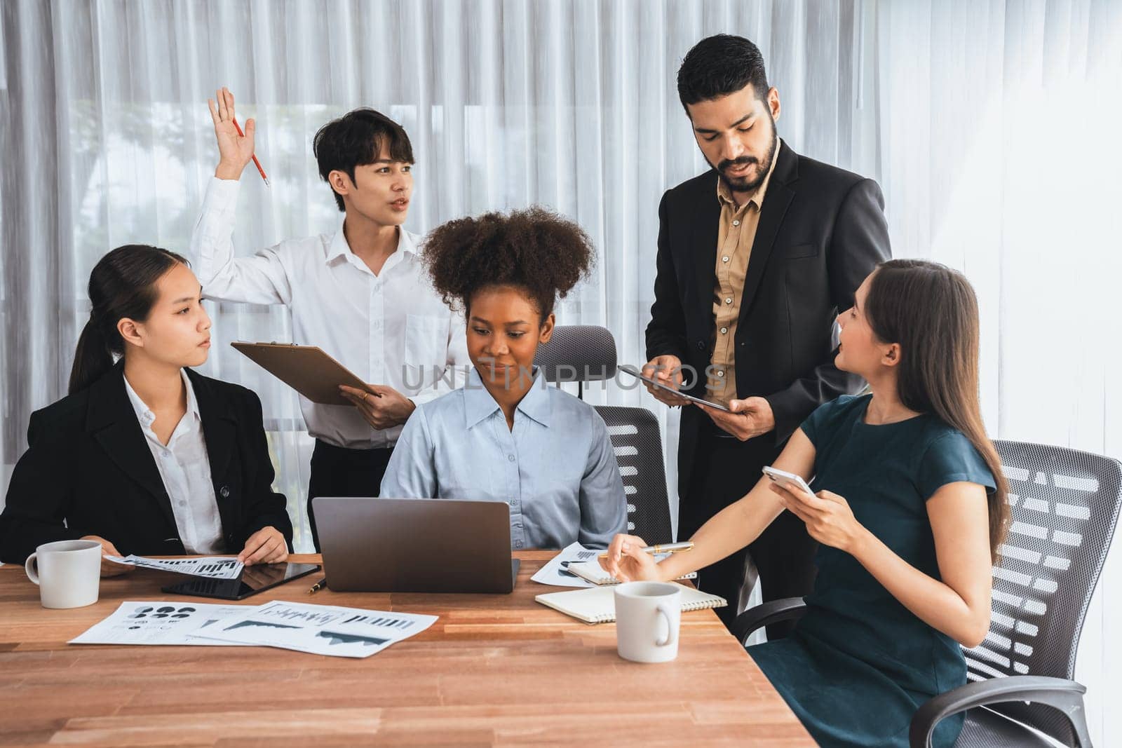 Multiracial analyst team use BI dashboard data to analyze financial report on meeting table. Group of diverse business people utilize data analysis by FIntech for success business marketing. Concord