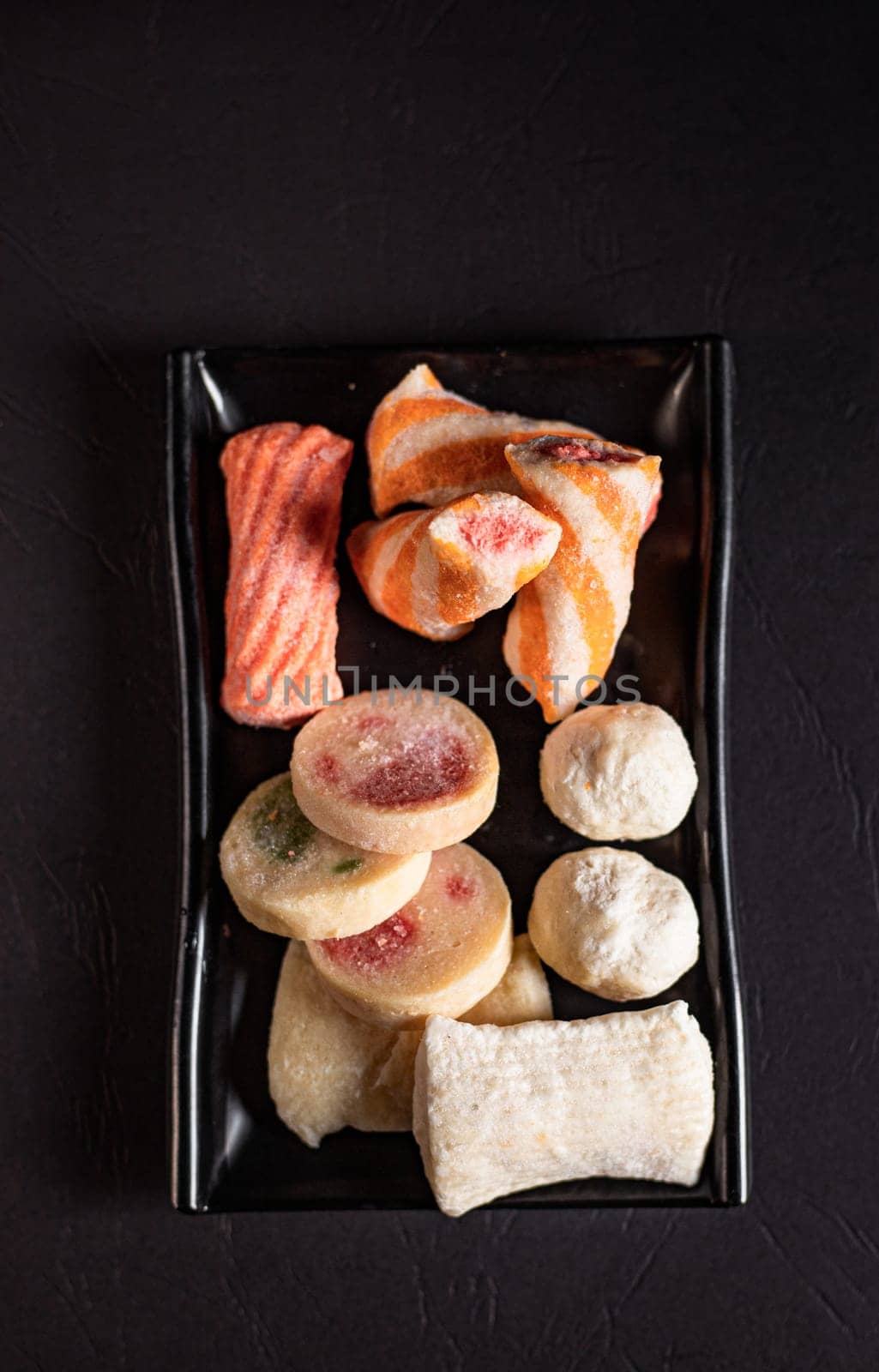 chinese soy meatballs on a black plate. Chinese cuisine, ingredient for hotpot by tewolf