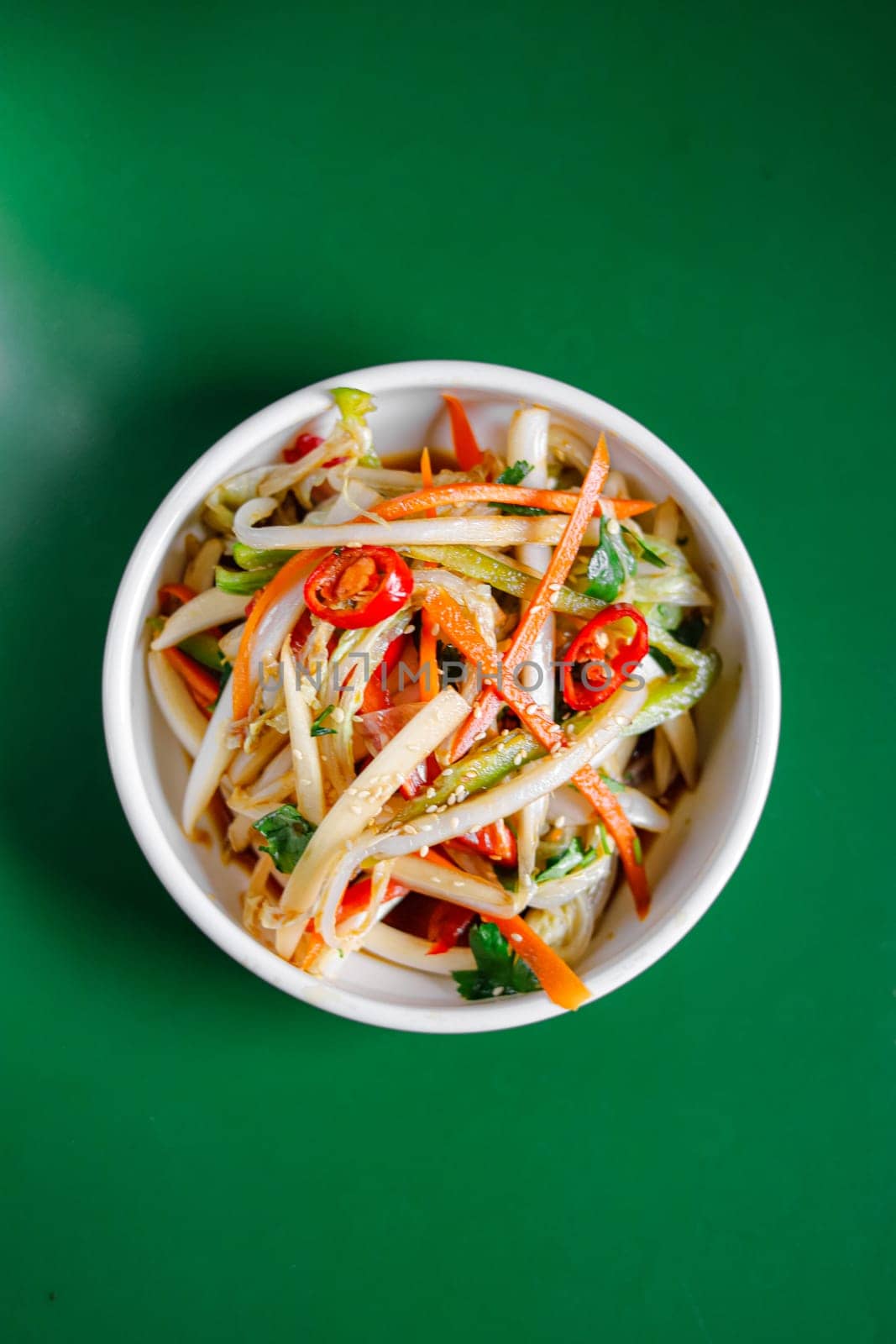 chinese cabbage salad with carrot in a white bowl. View from above. Chinese cuisine, ingredient for hotpot by tewolf