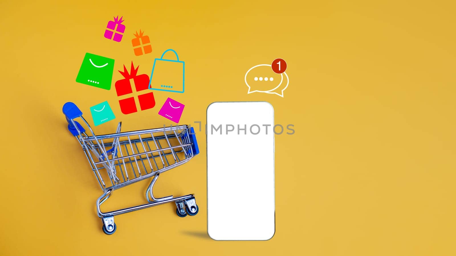 Shopping car and empty smartphone on yellow background. shopping online concept. by Unimages2527