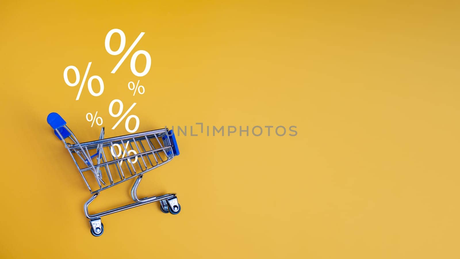 Sale percentage falling in shopping car on yellow background. Shopping online concept, Special price products, Specialand promotion. by Unimages2527