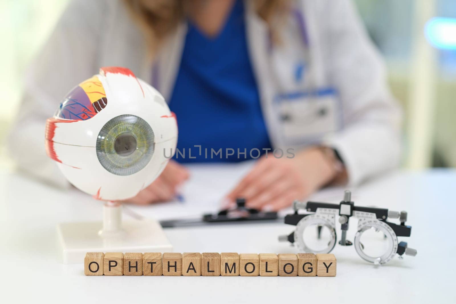 A model eye and visual testing tools highlight the complex field of ophthalmology in a clinical setting