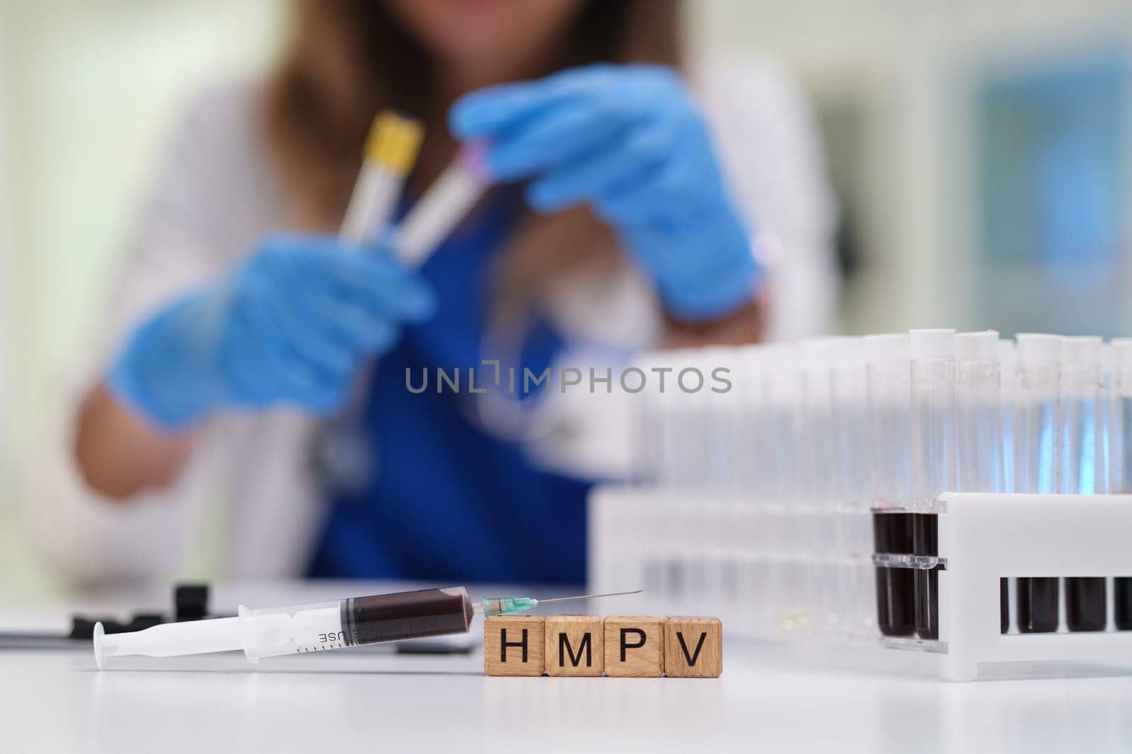 A healthcare professional meticulously working with various blood samples within a controlled laboratory setting