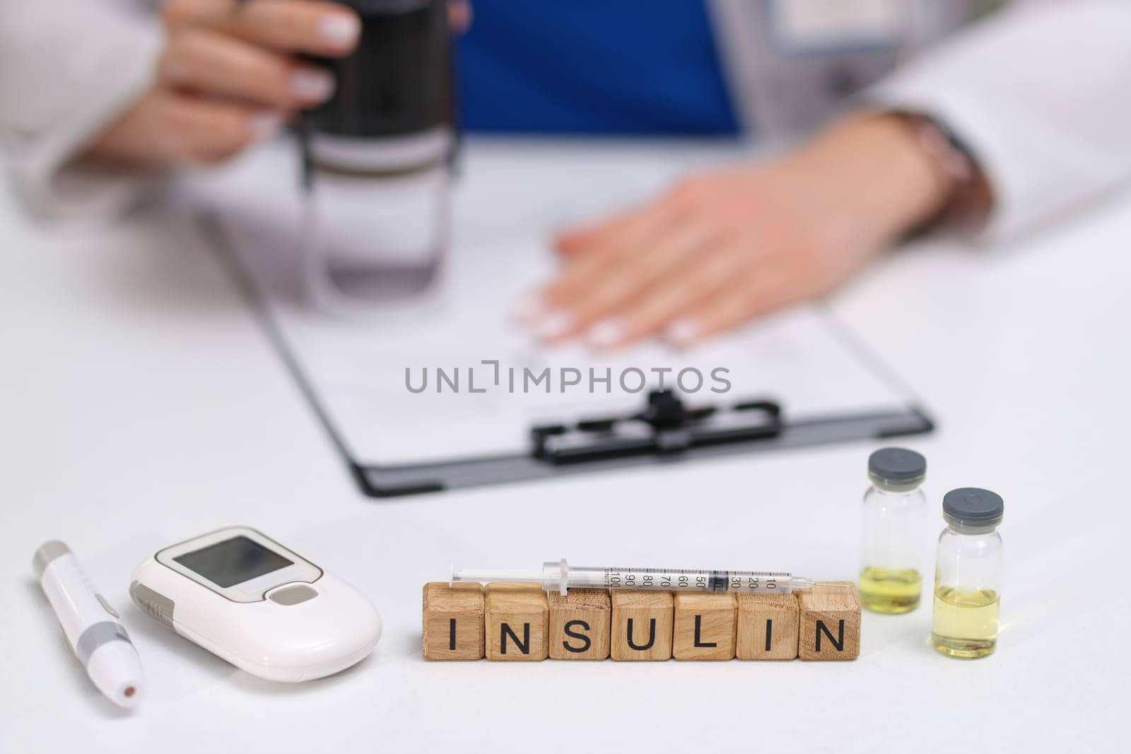 A comprehensive diabetes care layout that includes insulin, a glucometer, and various essential medical tools