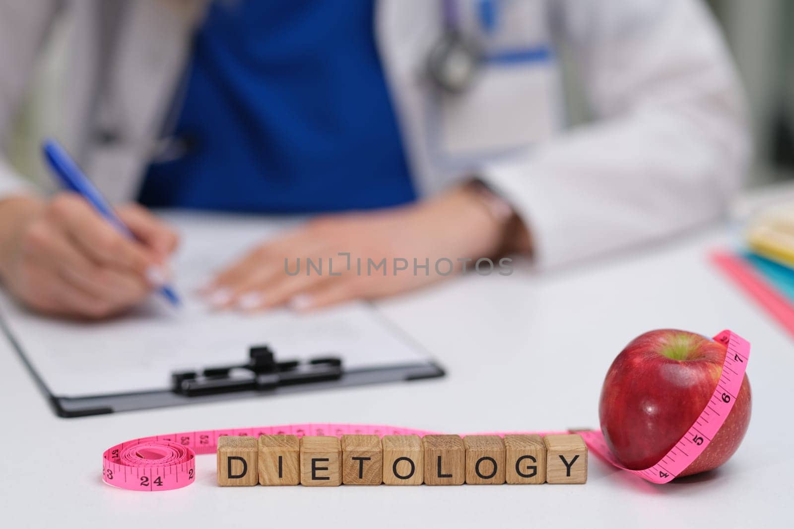 A workspace meant for a healthcare professional that prominently features various dietology elements