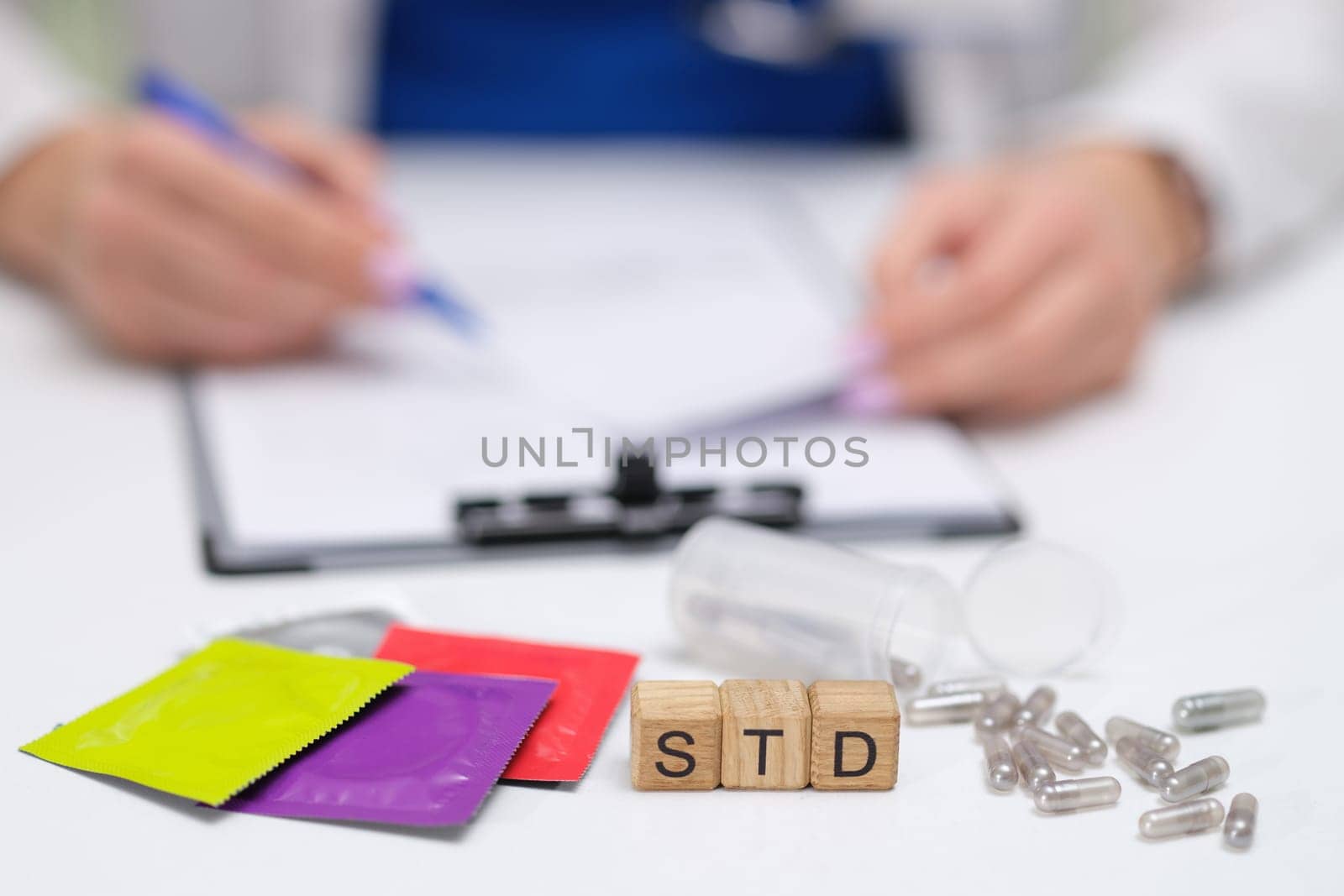 A doctor discusses STD treatments, including medications and educational packets for patient understanding