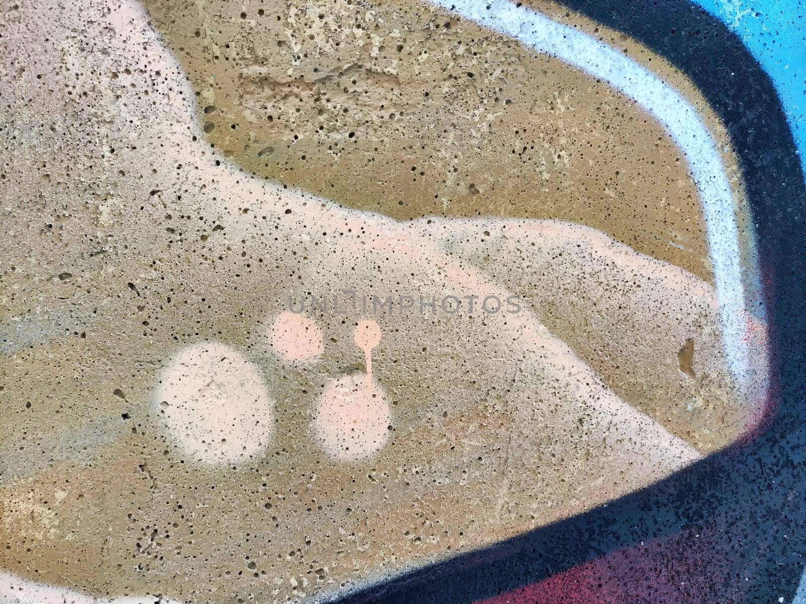 Colorful abstract art showcases soft circles and textures on a textured wall, inviting creativity and interpretation.