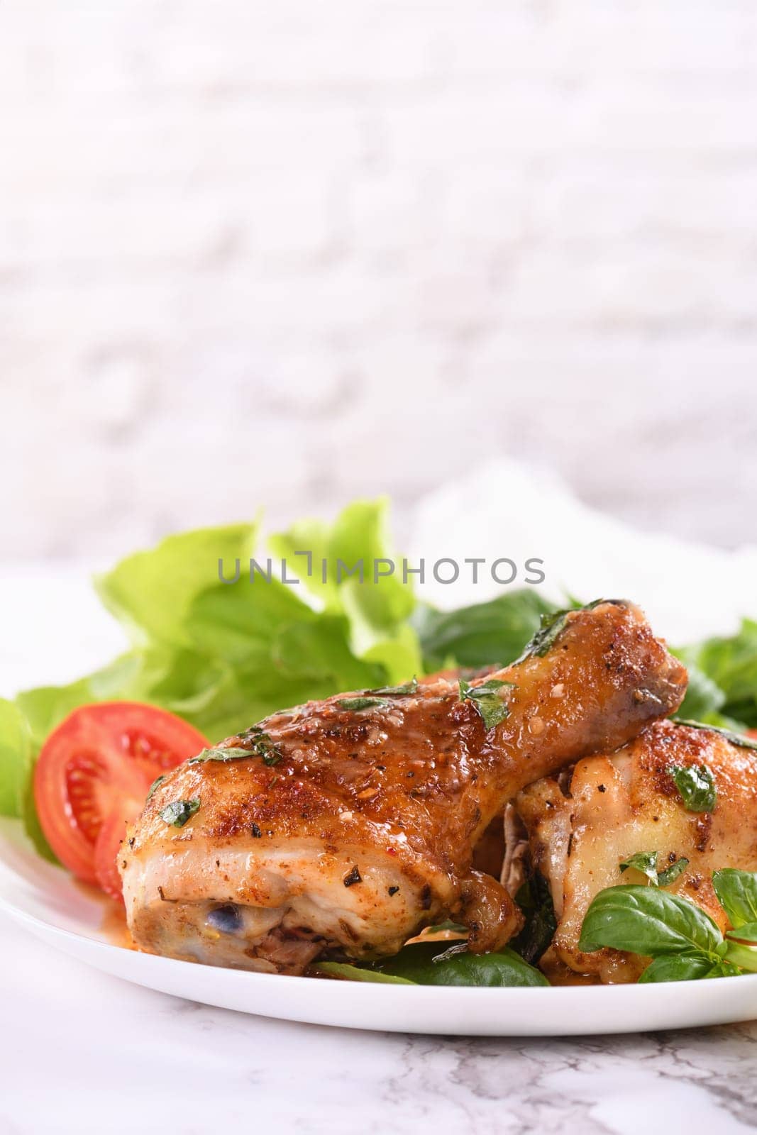 Fried chicken drumstick with gravy and vegetable side dish